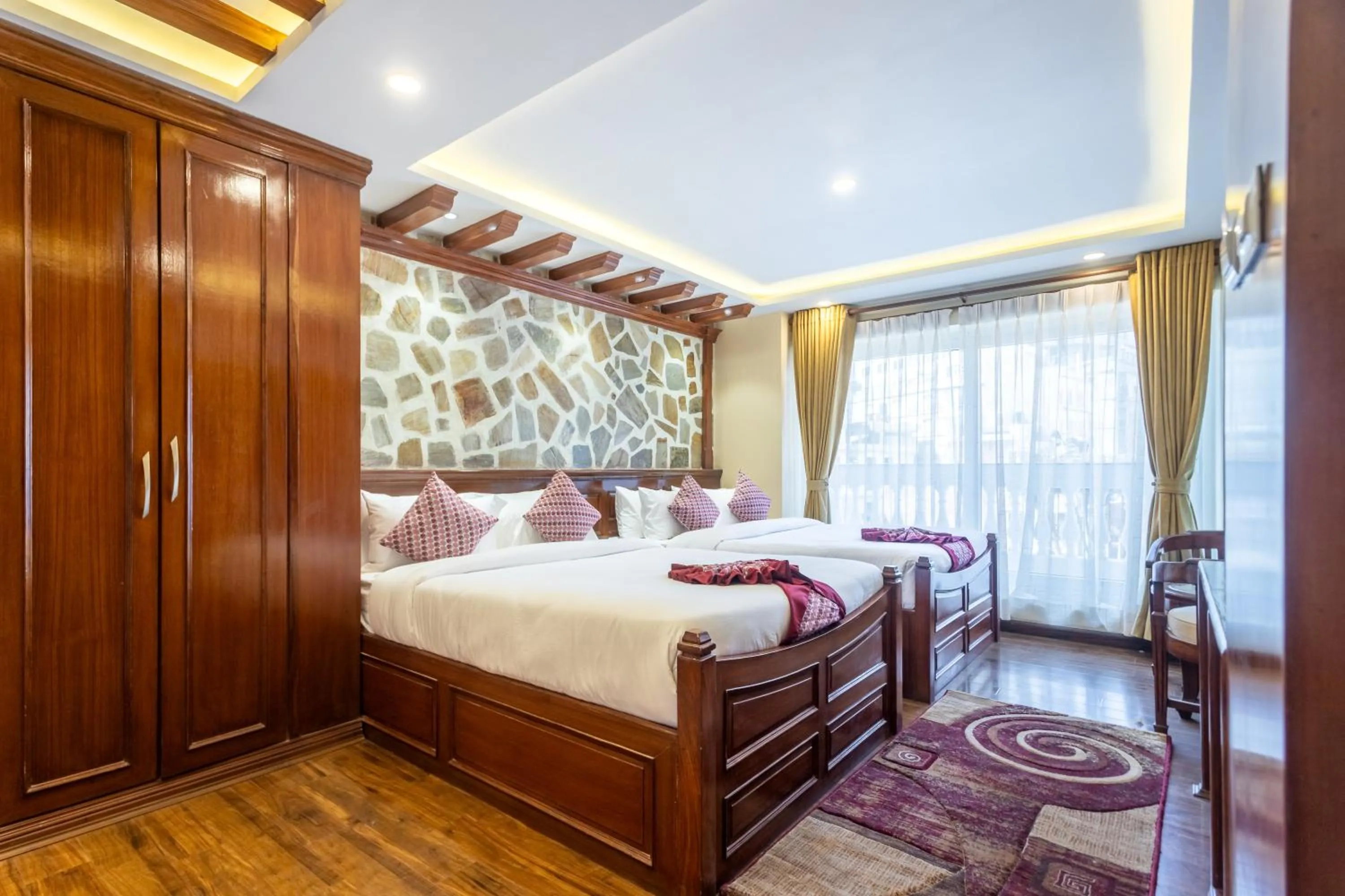 Bed in Amarawati Boutique Hotel