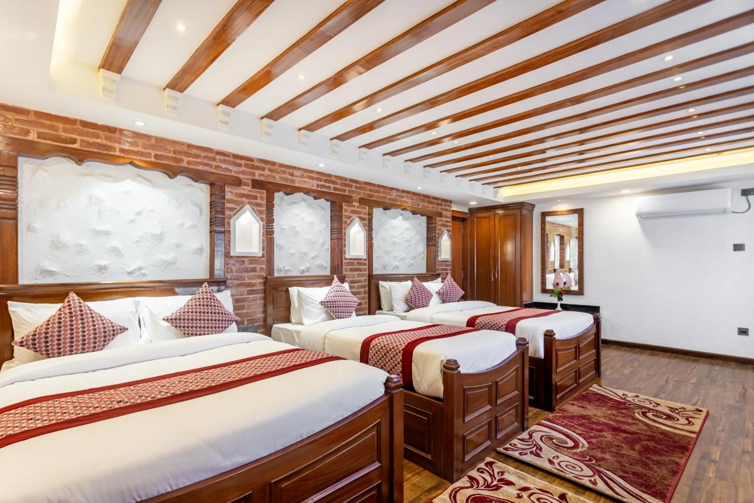 Bed in Amarawati Boutique Hotel