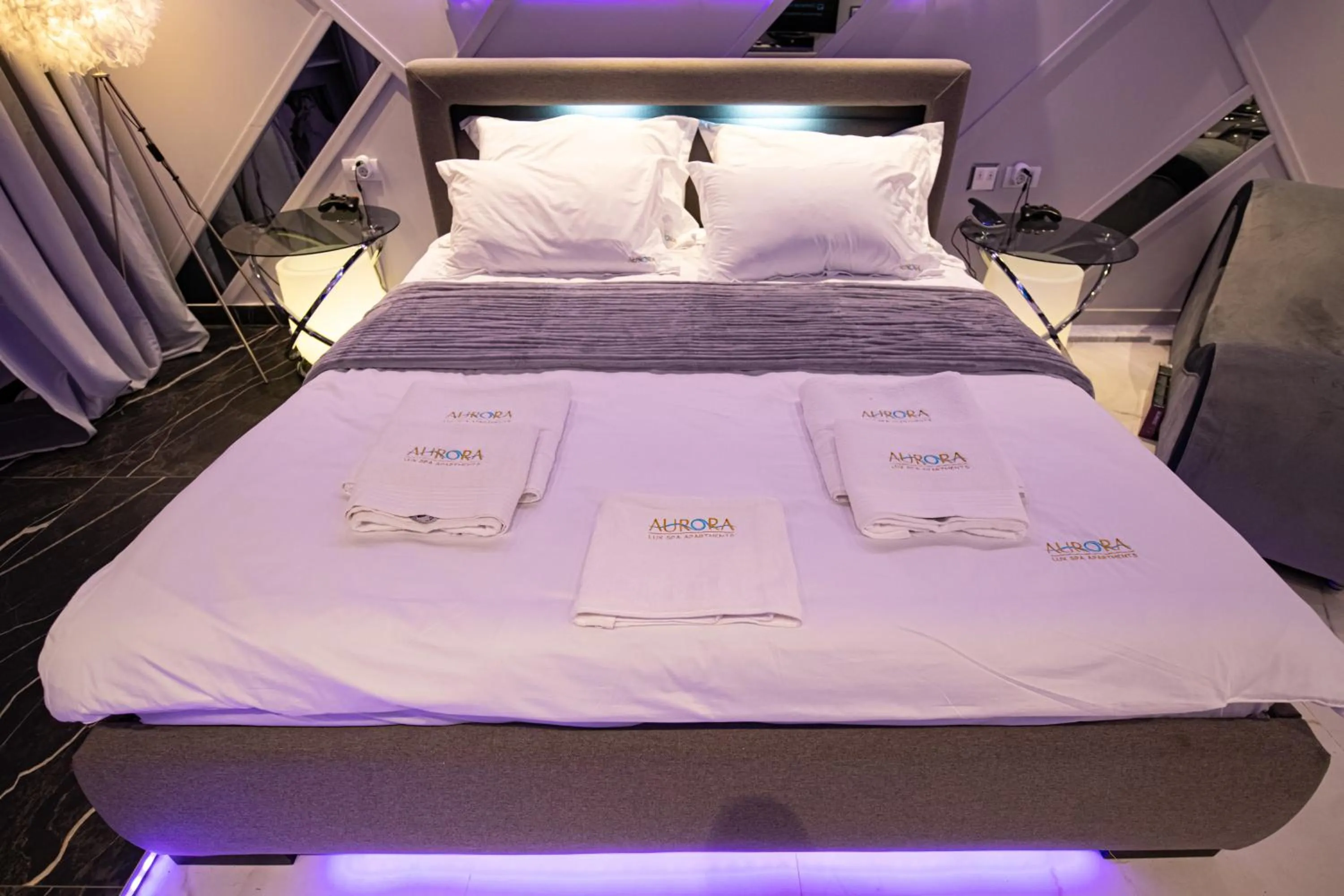 Bed in Aurora Lux Spa Smart apartments