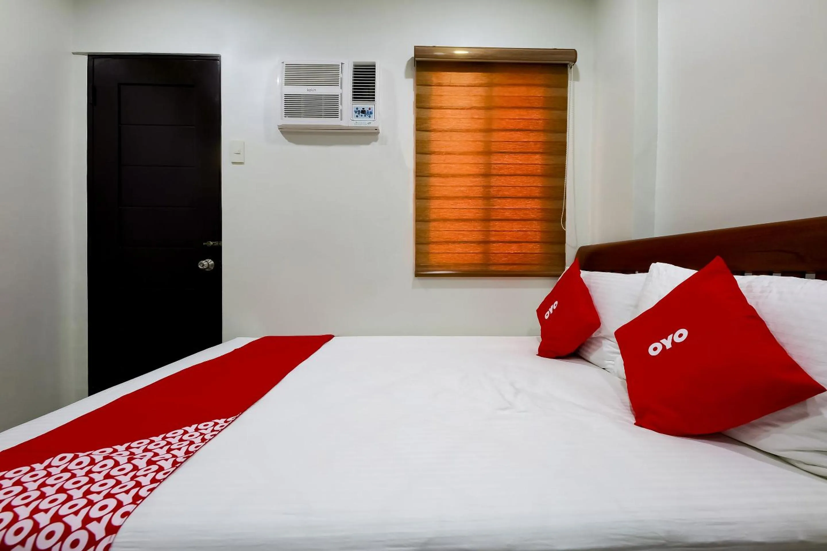 Bedroom in OYO 848 Dona Aurora Condotel