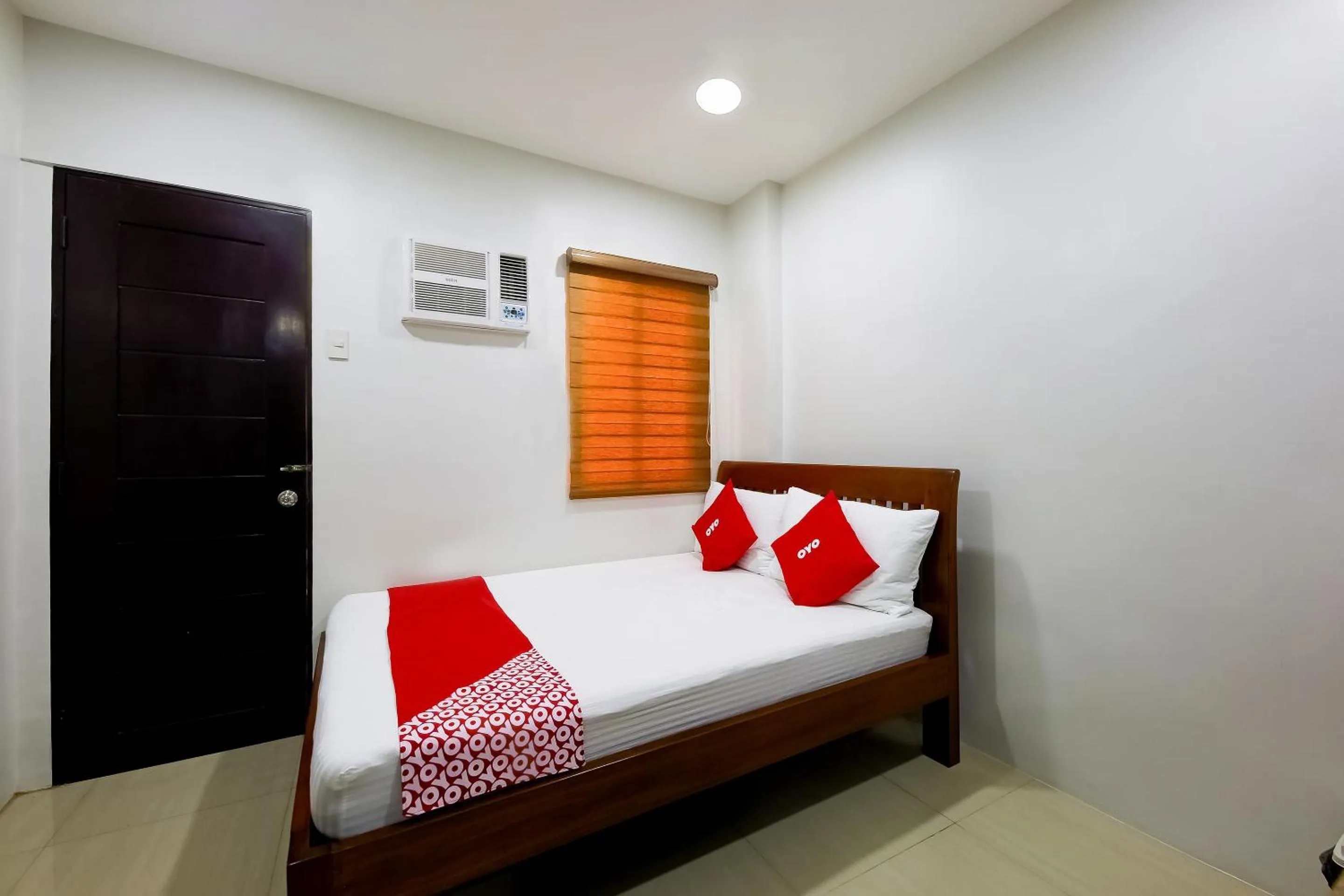 Bedroom in OYO 848 Dona Aurora Condotel