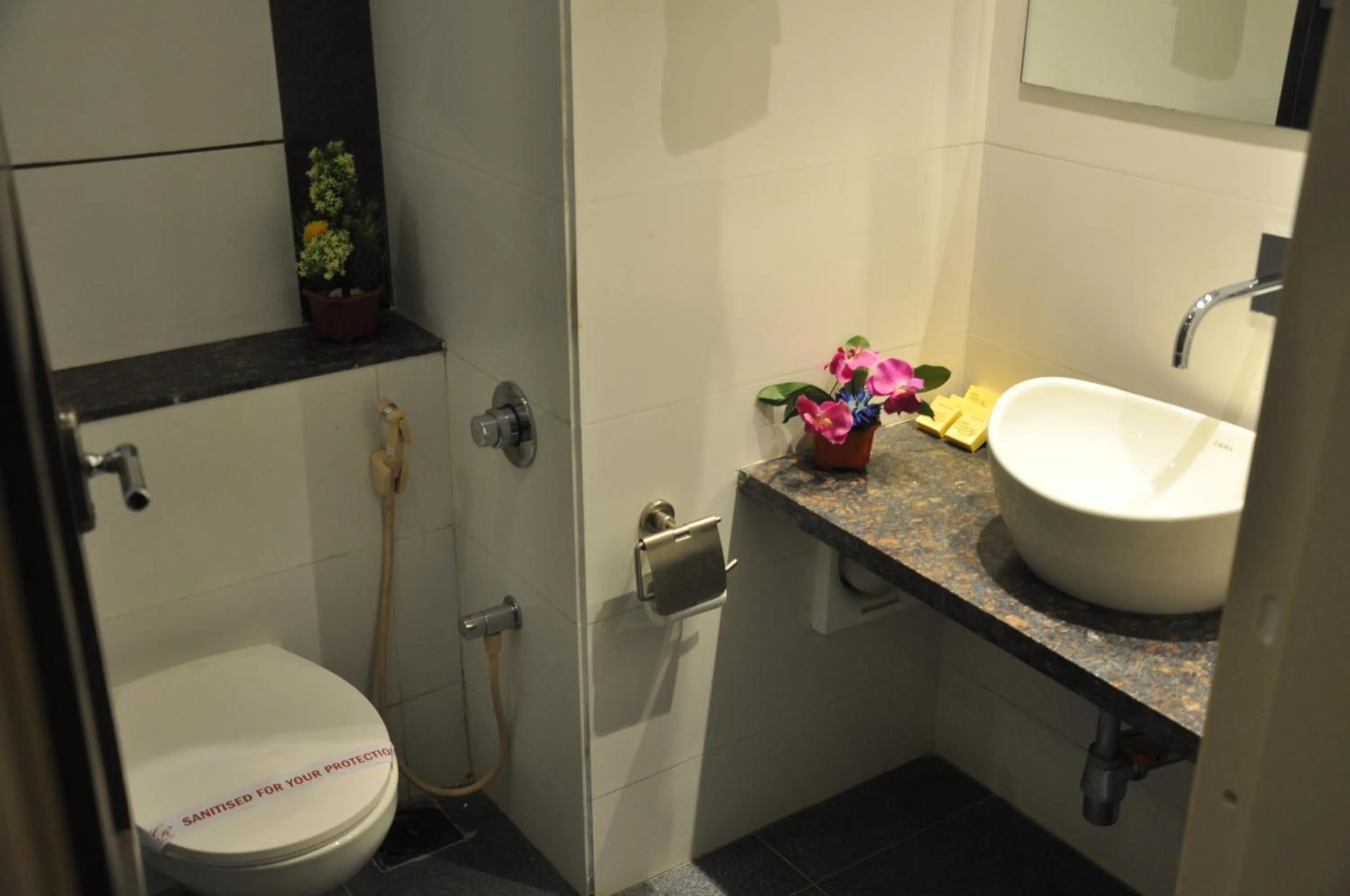 Bathroom in Pride Biznotel Alkapuri Near Vadodara Airport