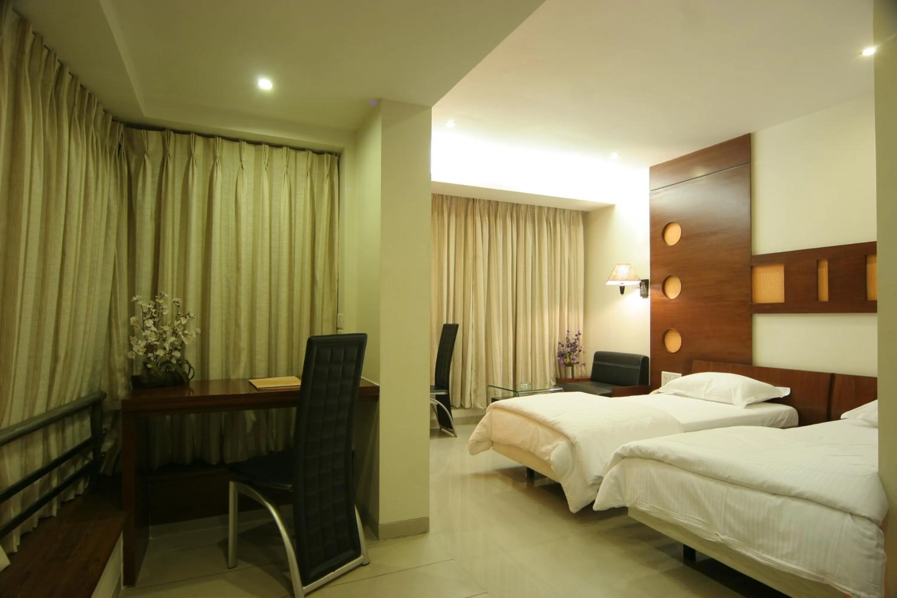 Photo of the whole room, Bed in Pride Biznotel Alkapuri Near Vadodara Airport