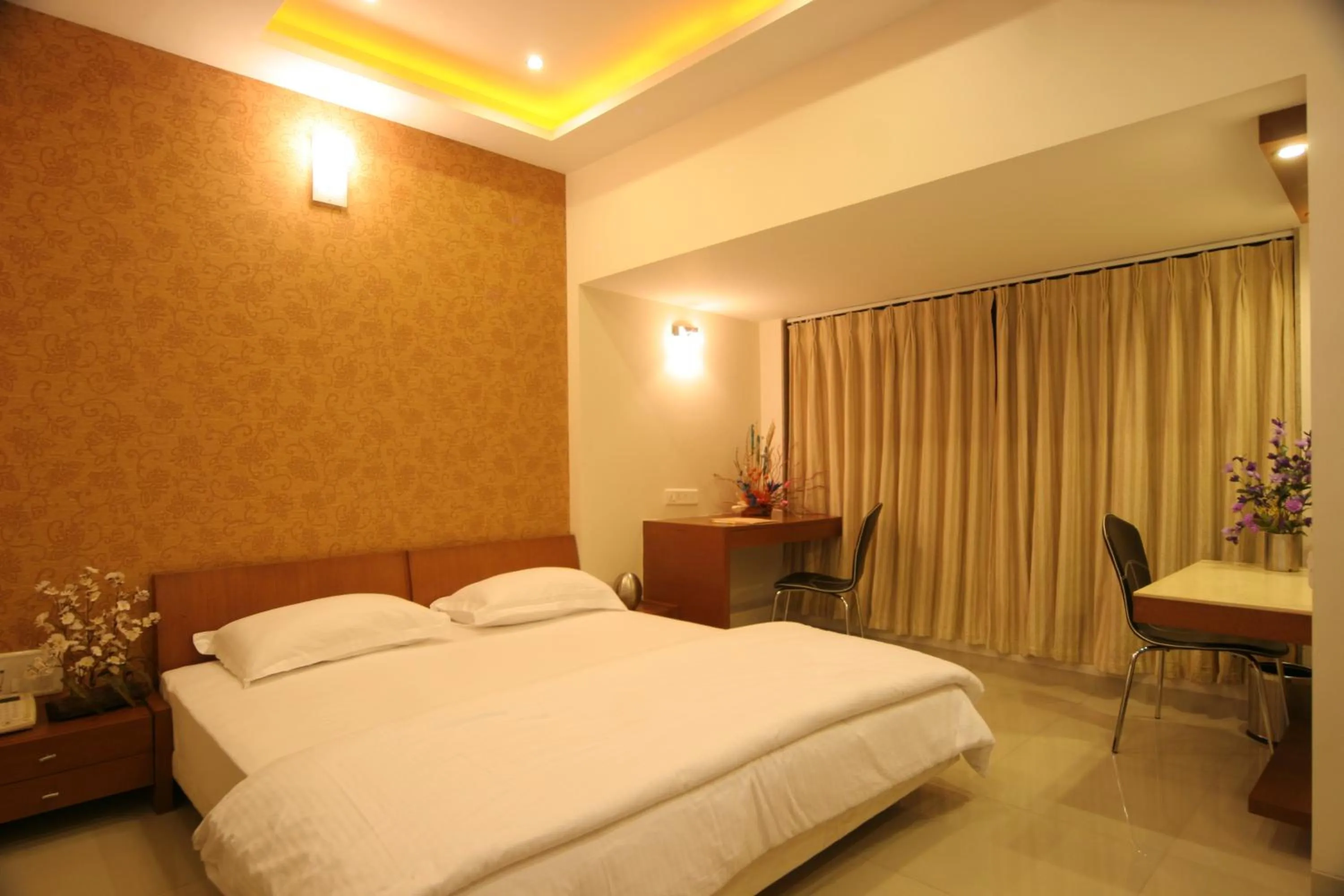 Photo of the whole room, Bed in Pride Biznotel Alkapuri Near Vadodara Airport