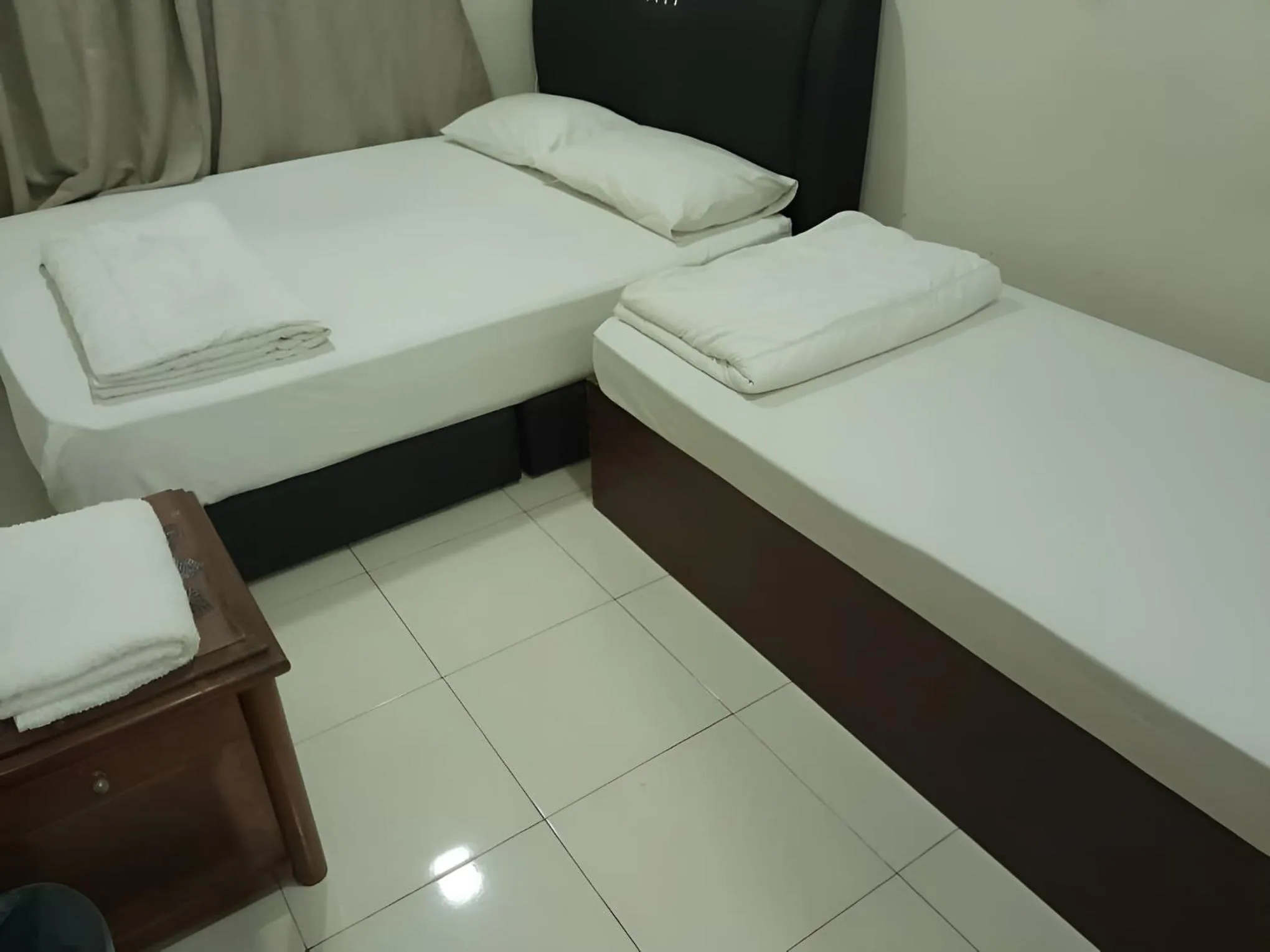 Photo of the whole room, Bed in FKI INTERNATIONAL HOTEL