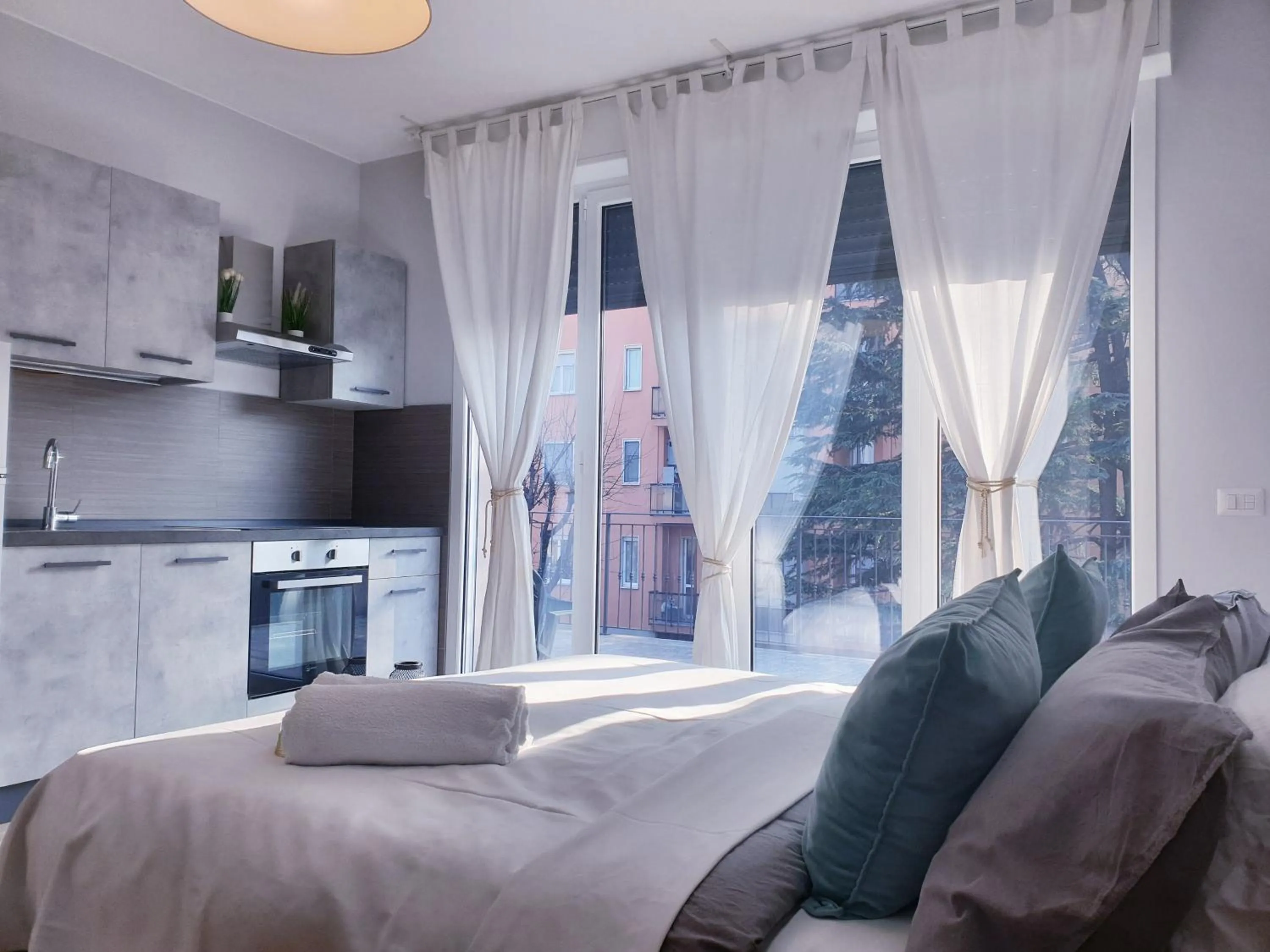 Living room, Bed in Michelangelo Apartments con parcheggio gratuito in loco e self check in