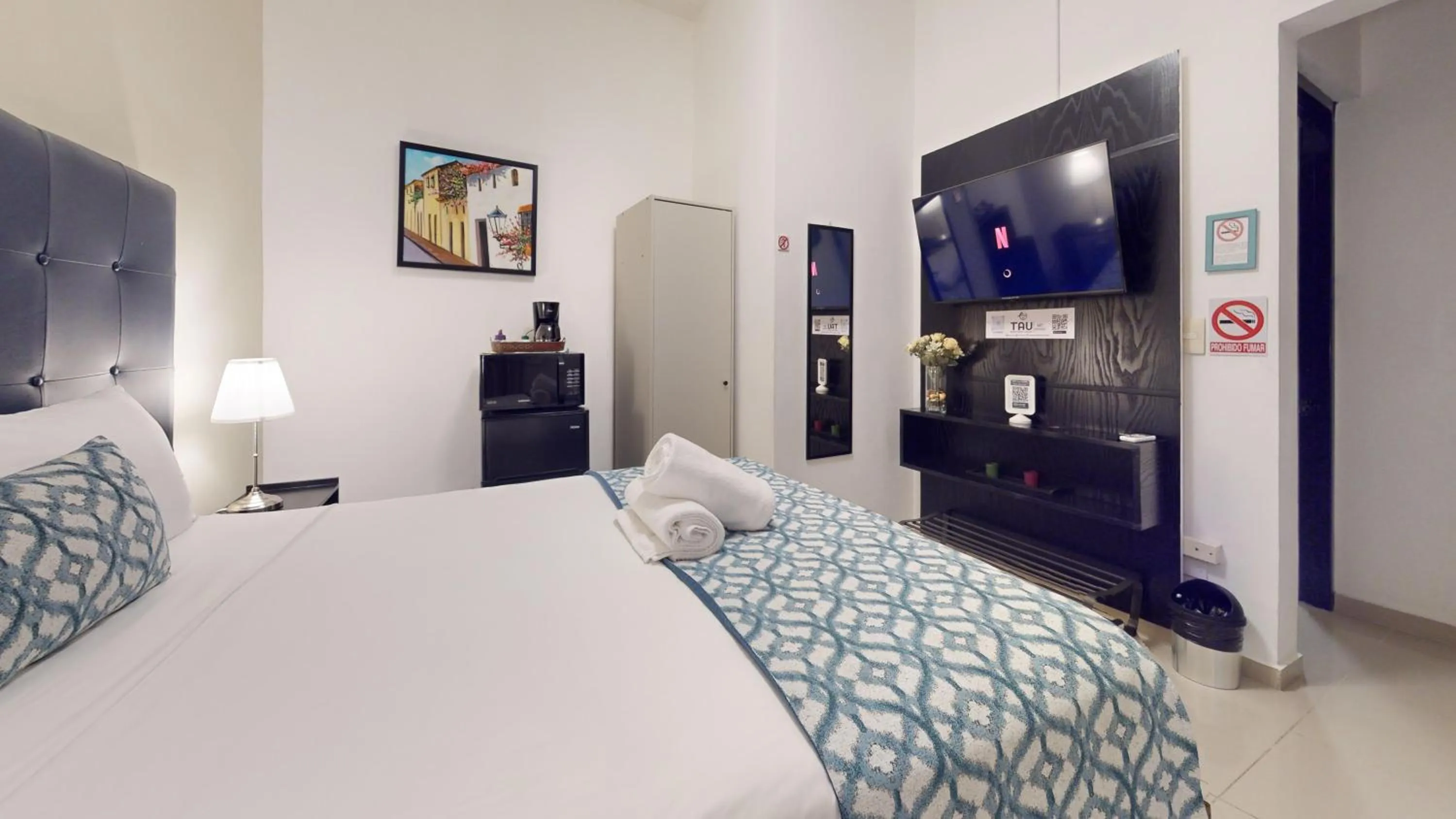 Bed in Hotel Tau Art Residence