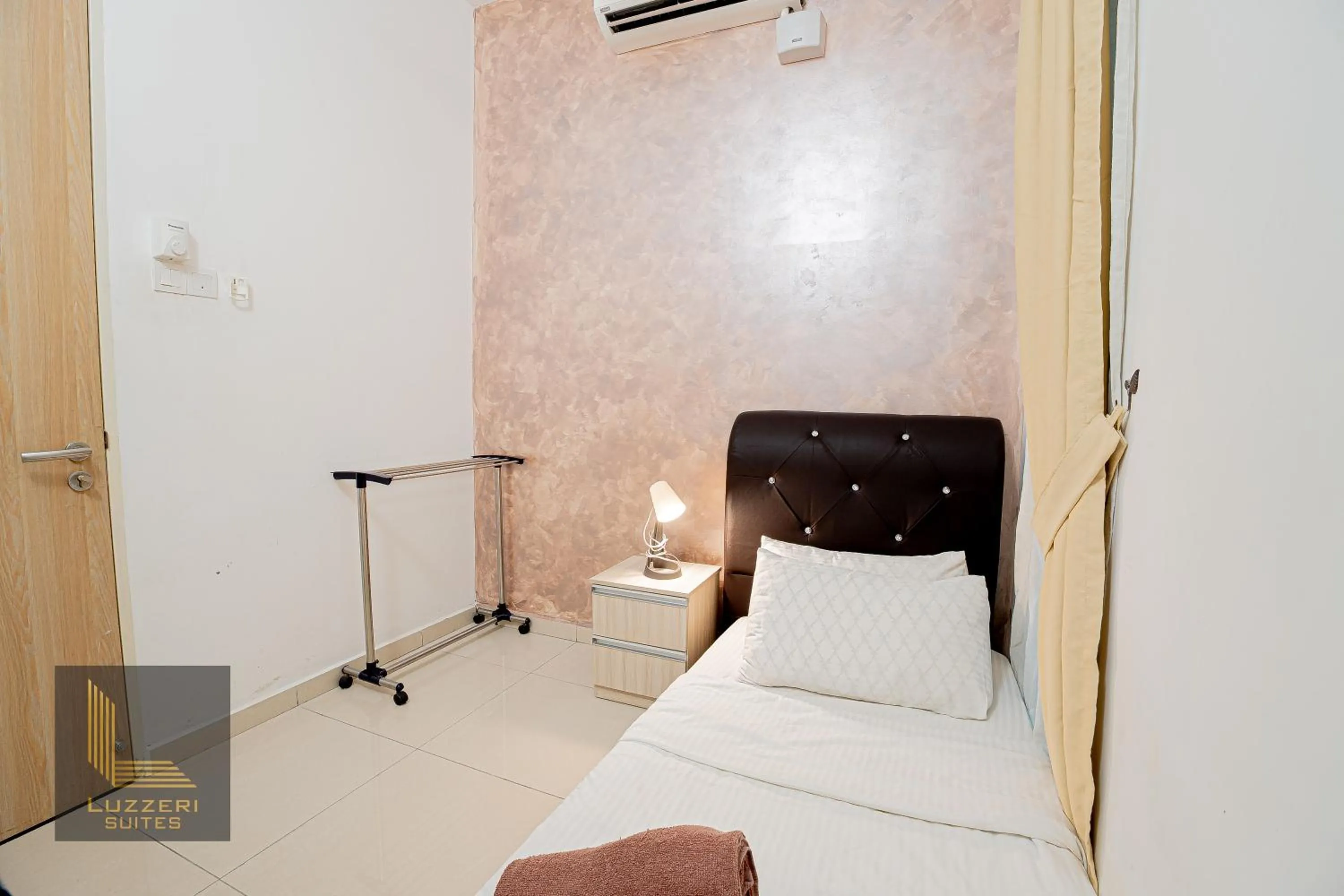 Bed in Legasi Kampung Baru Guesthouse