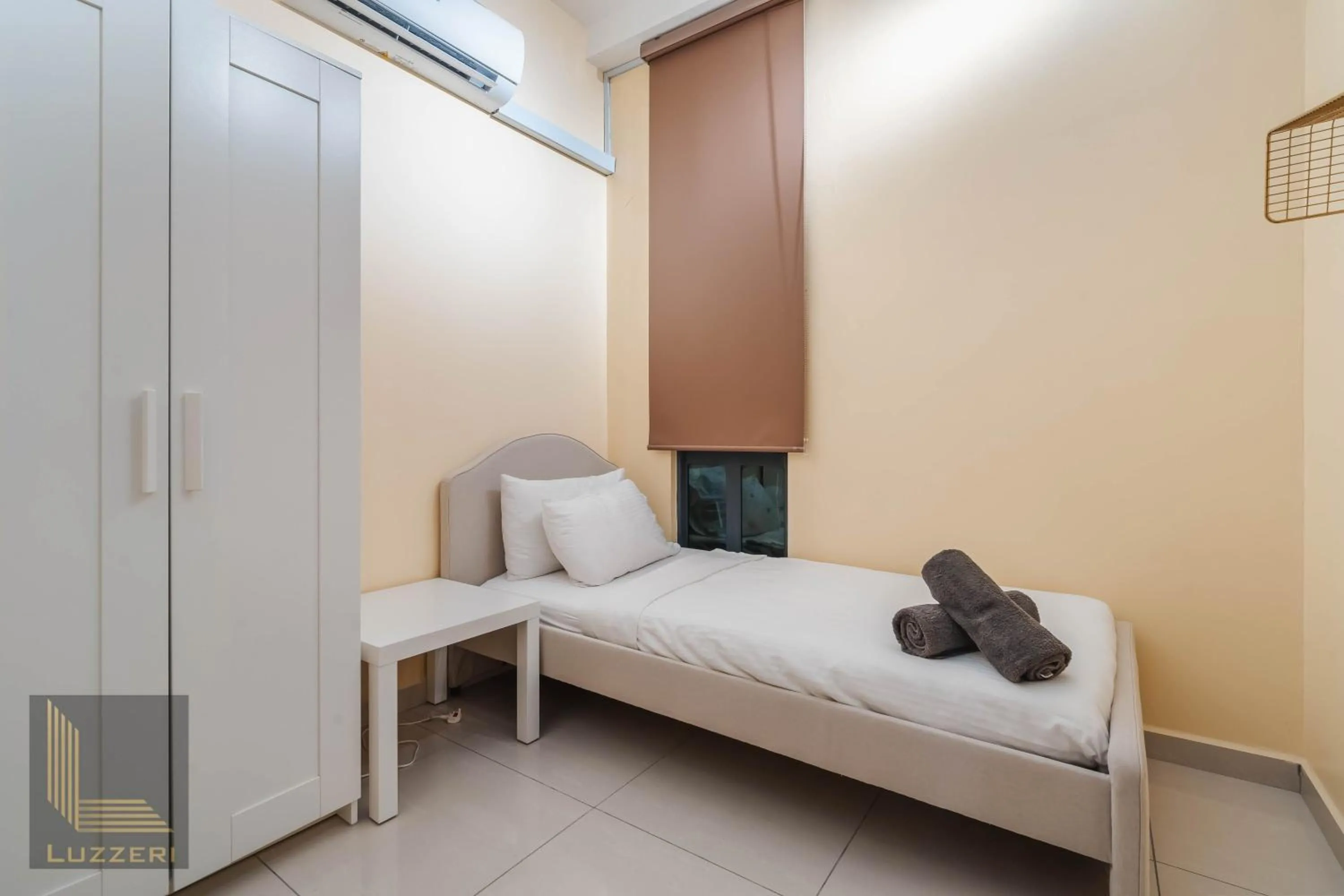 Bed in Legasi Kampung Baru Guesthouse