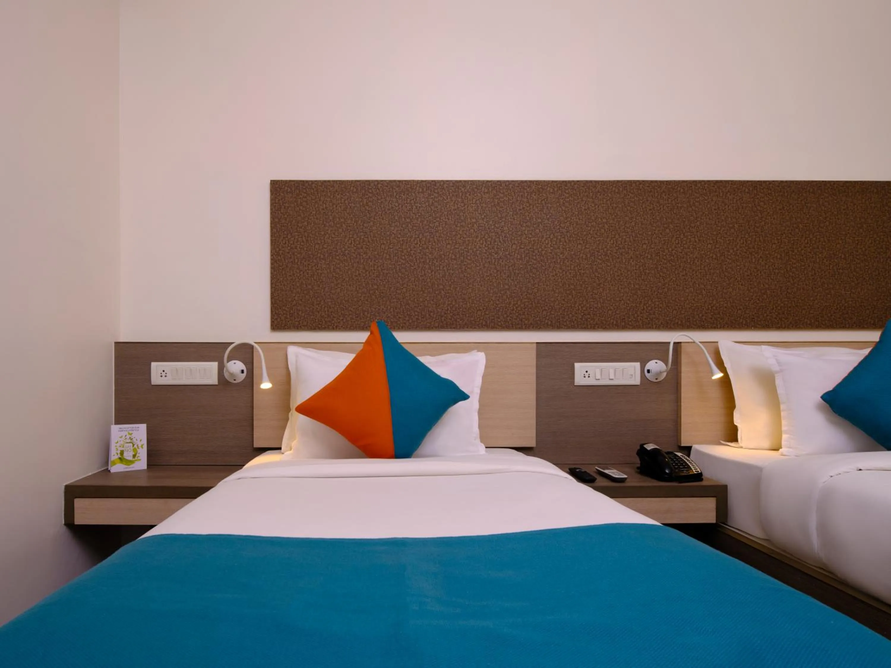 Bed in Pride Biznotel Manjusar Vadodara Near Sokhda Lake