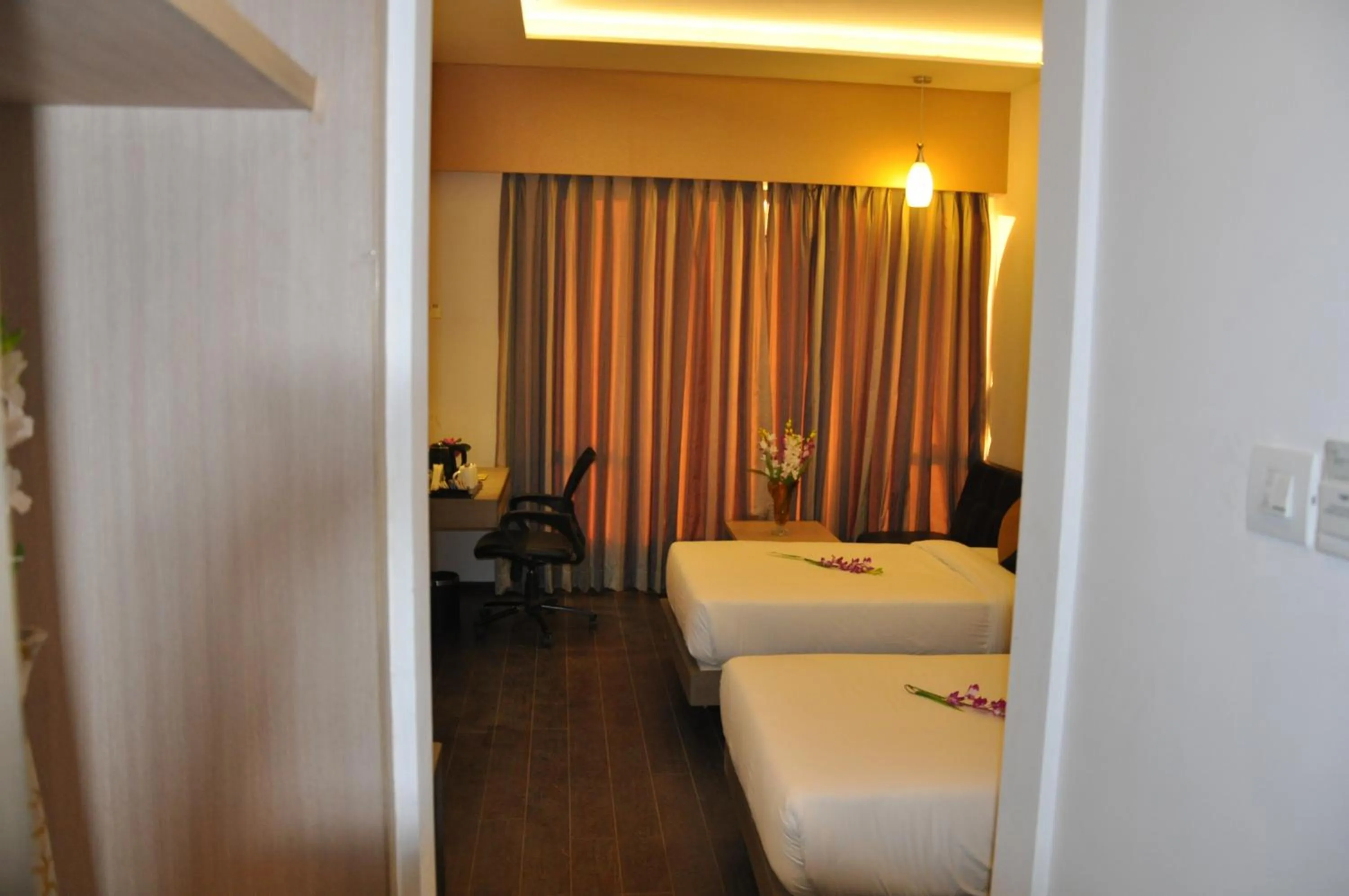 Photo of the whole room, Bed in Pride Biznotel Manjusar Vadodara Near Sokhda Lake