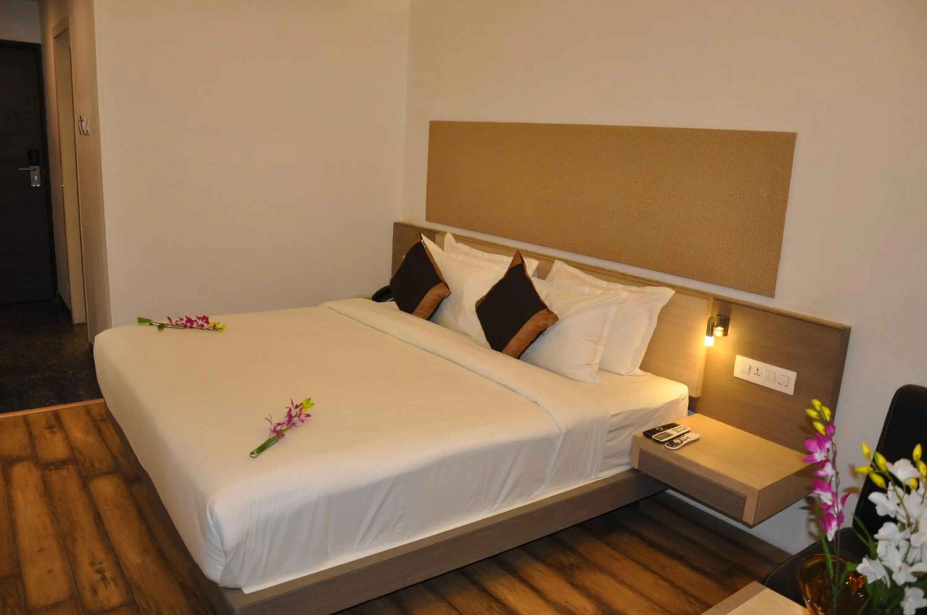 Bed in Pride Biznotel Manjusar Vadodara Near Sokhda Lake