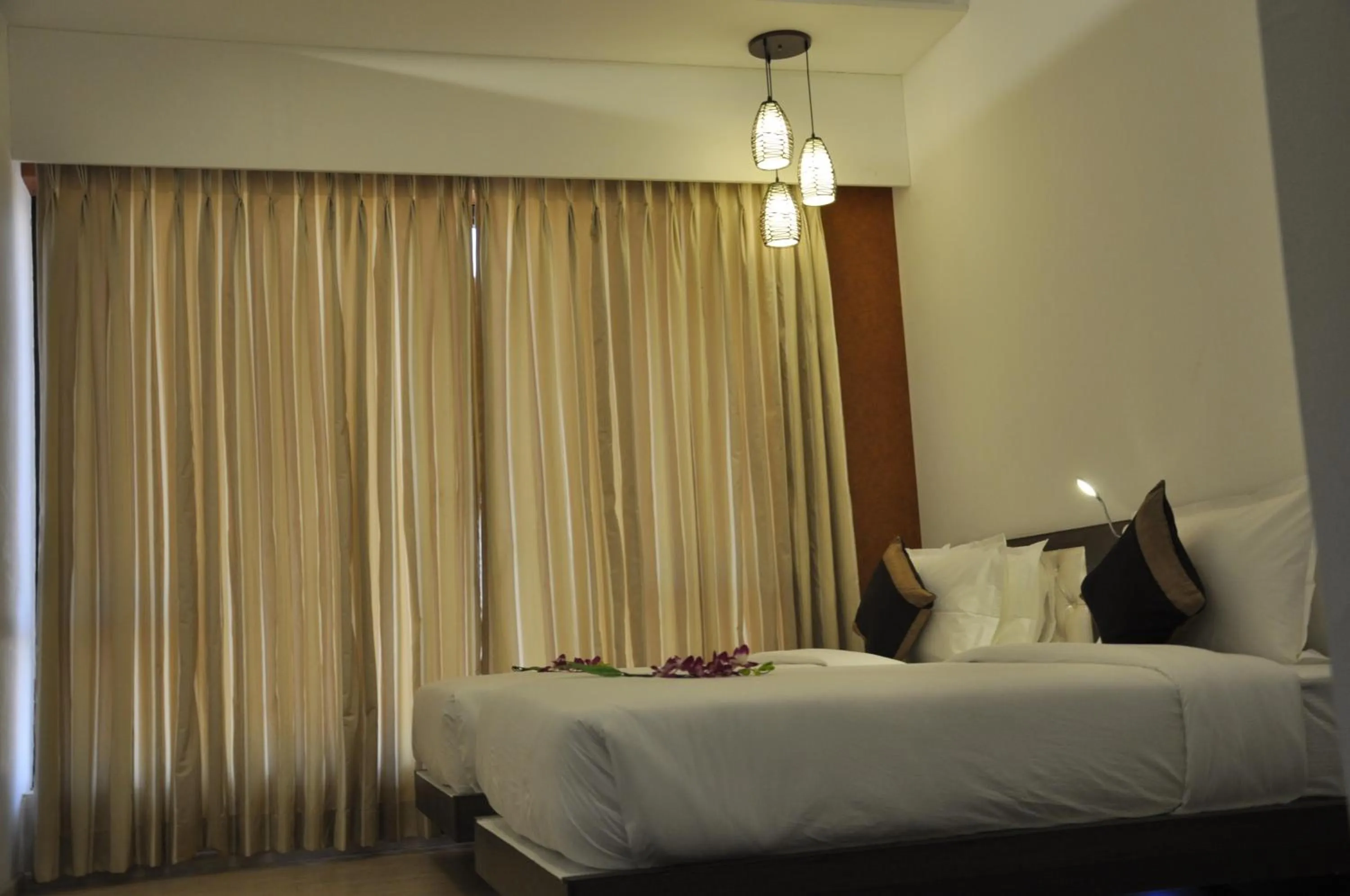 Photo of the whole room, Bed in Pride Biznotel Manjusar Vadodara Near Sokhda Lake