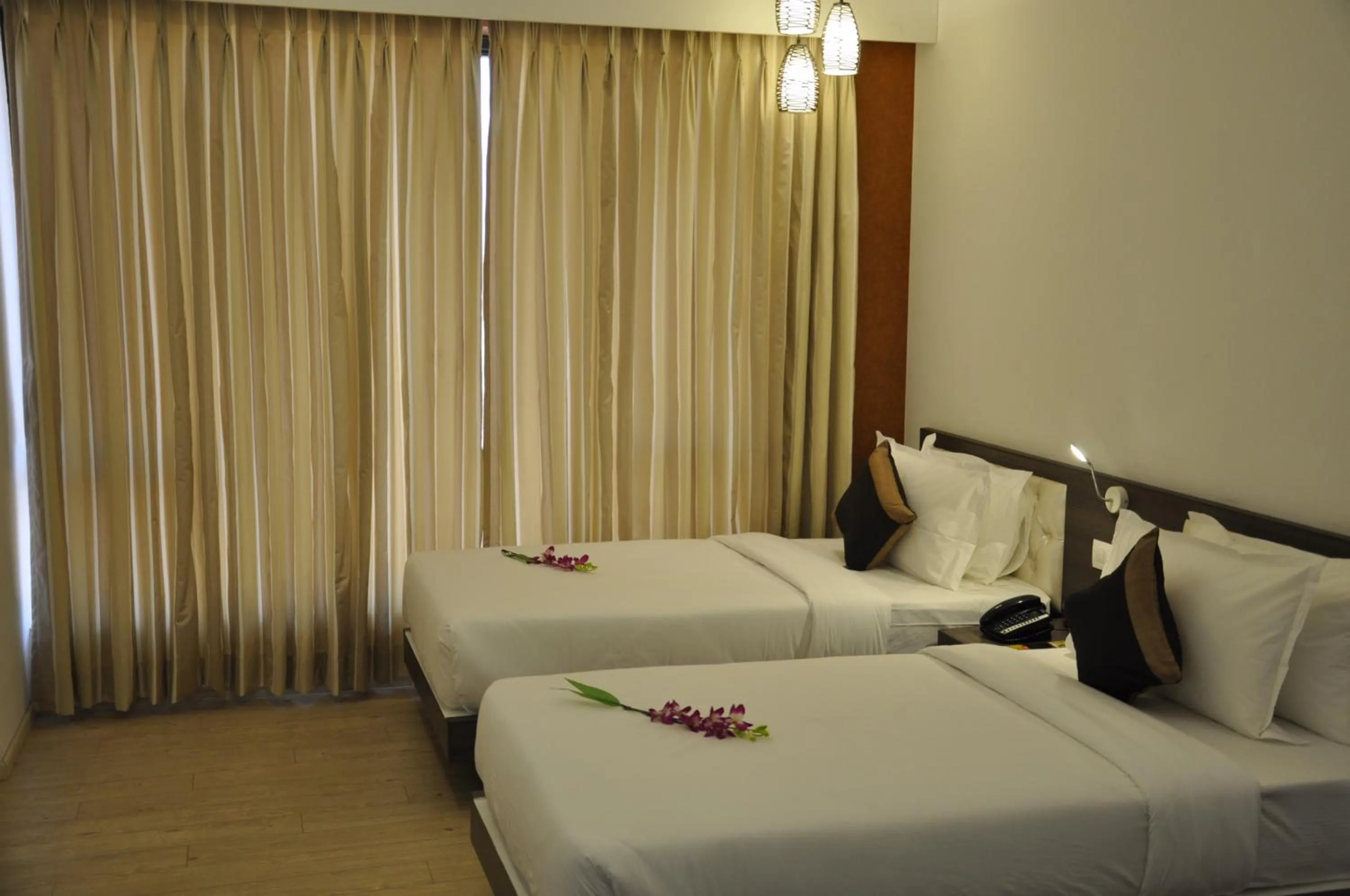 Photo of the whole room, Bed in Pride Biznotel Manjusar Vadodara Near Sokhda Lake
