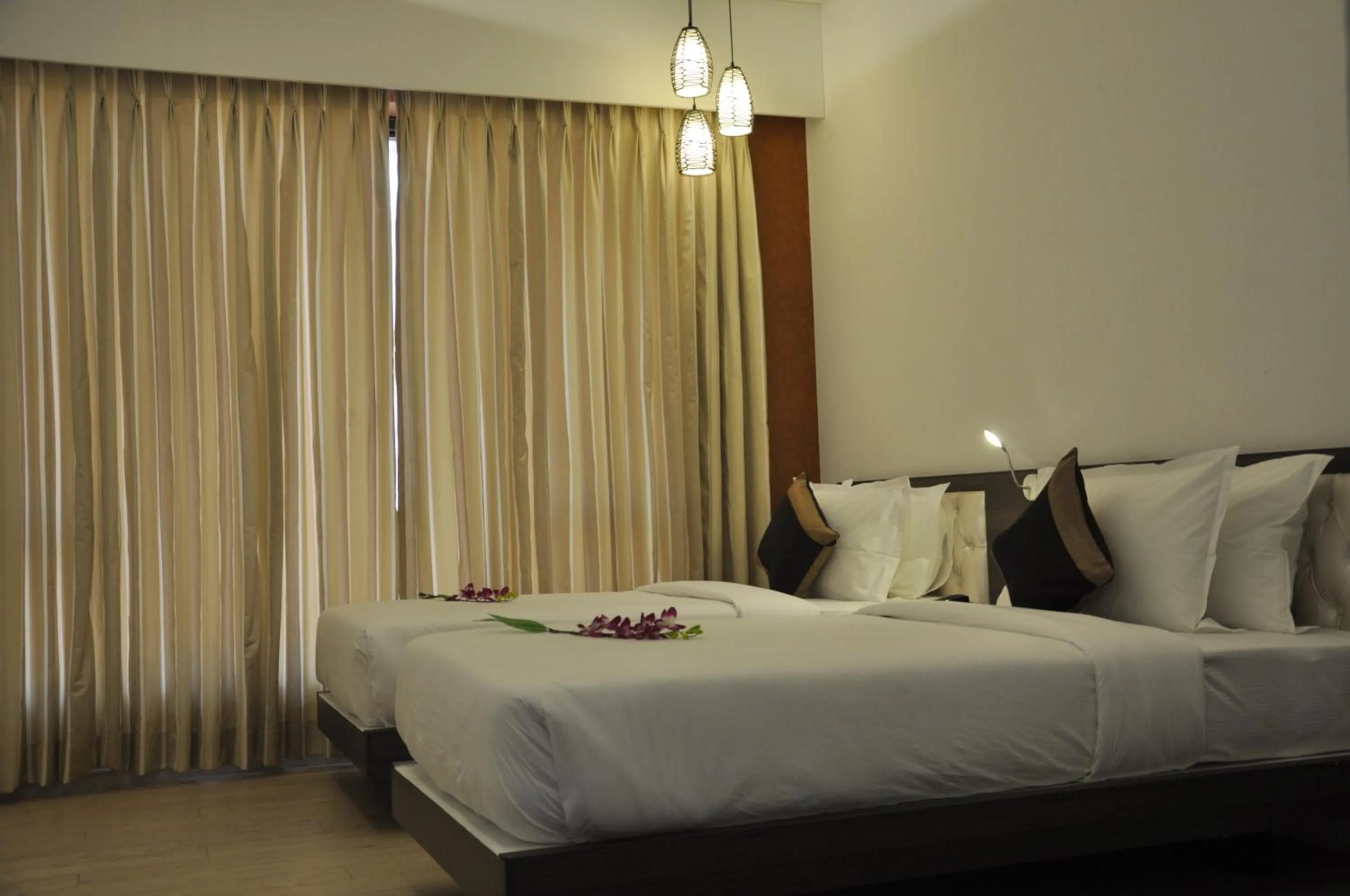 Photo of the whole room, Bed in Pride Biznotel Manjusar Vadodara Near Sokhda Lake