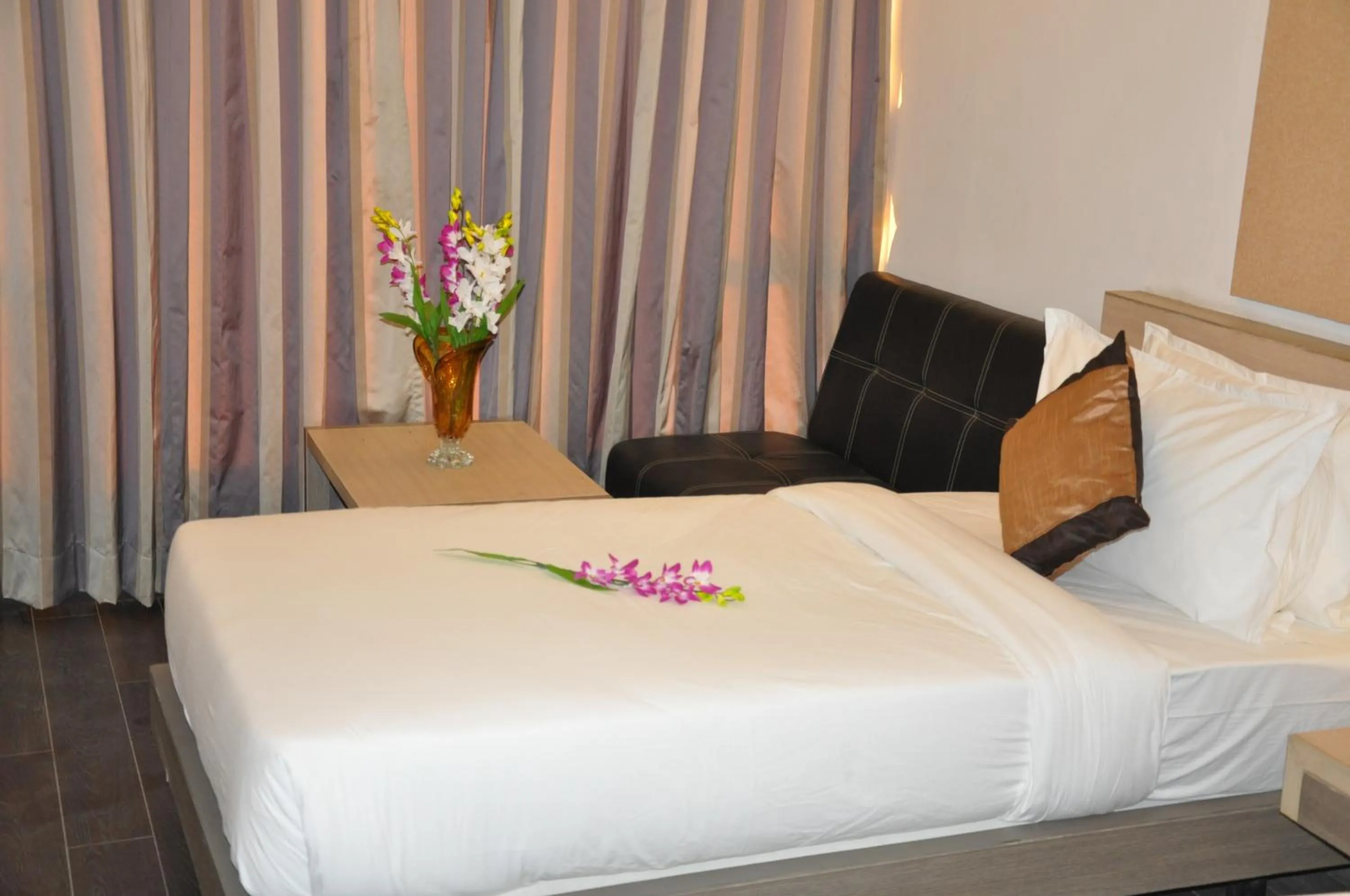 Photo of the whole room, Bed in Pride Biznotel Manjusar Vadodara Near Sokhda Lake