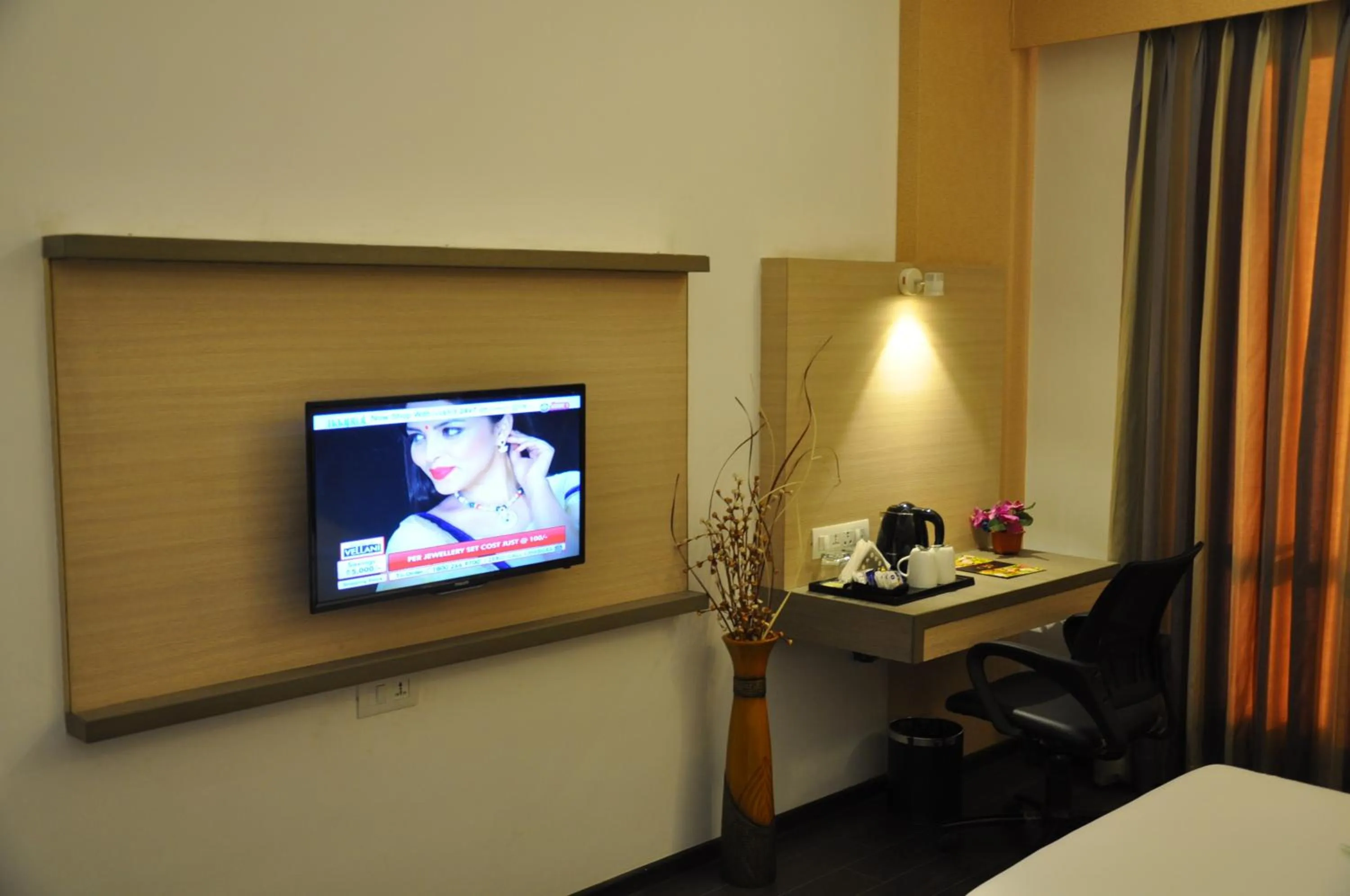 TV and multimedia in Pride Biznotel Manjusar Vadodara Near Sokhda Lake