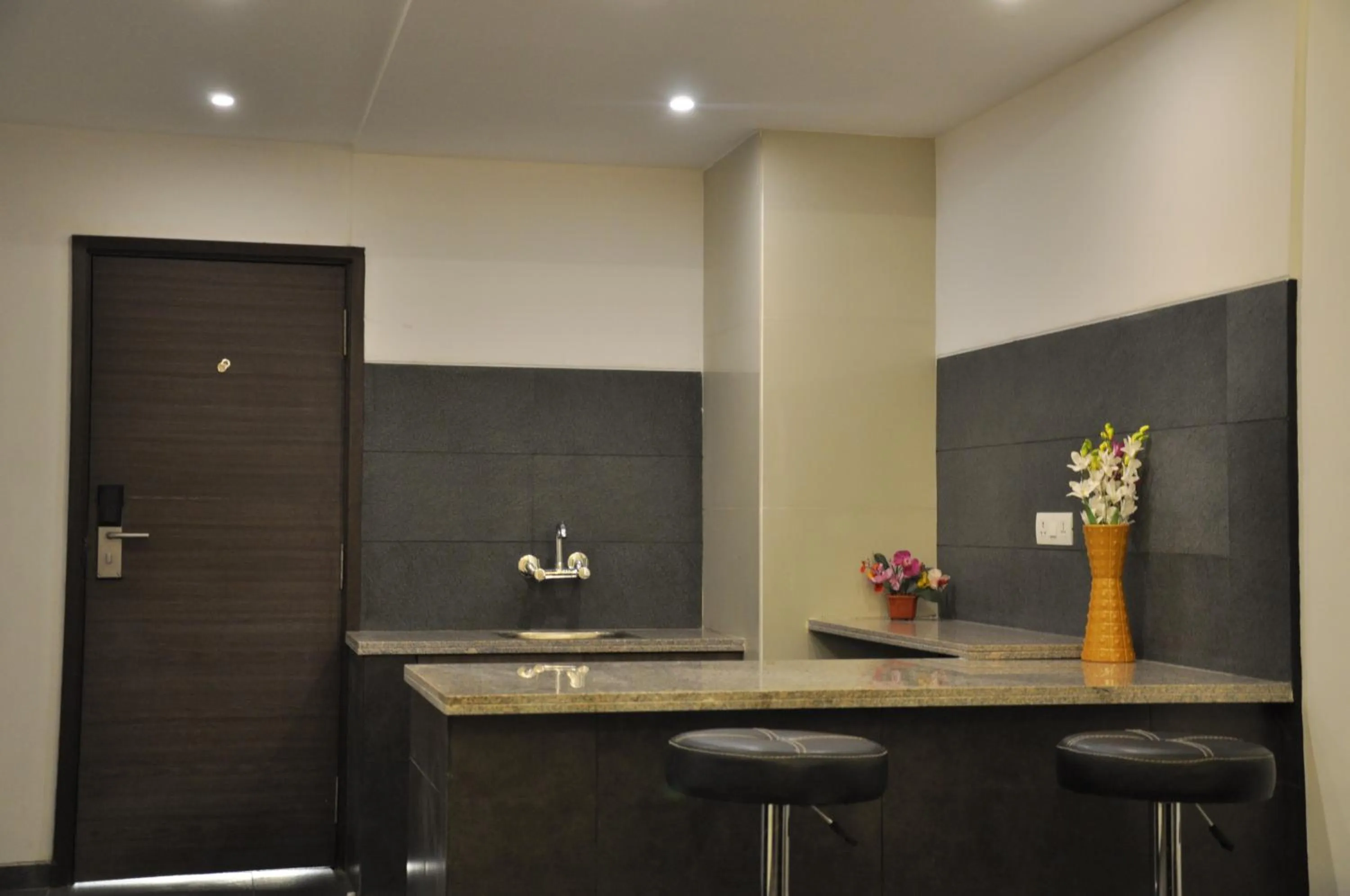 Kitchen or kitchenette in Pride Biznotel Manjusar Vadodara Near Sokhda Lake