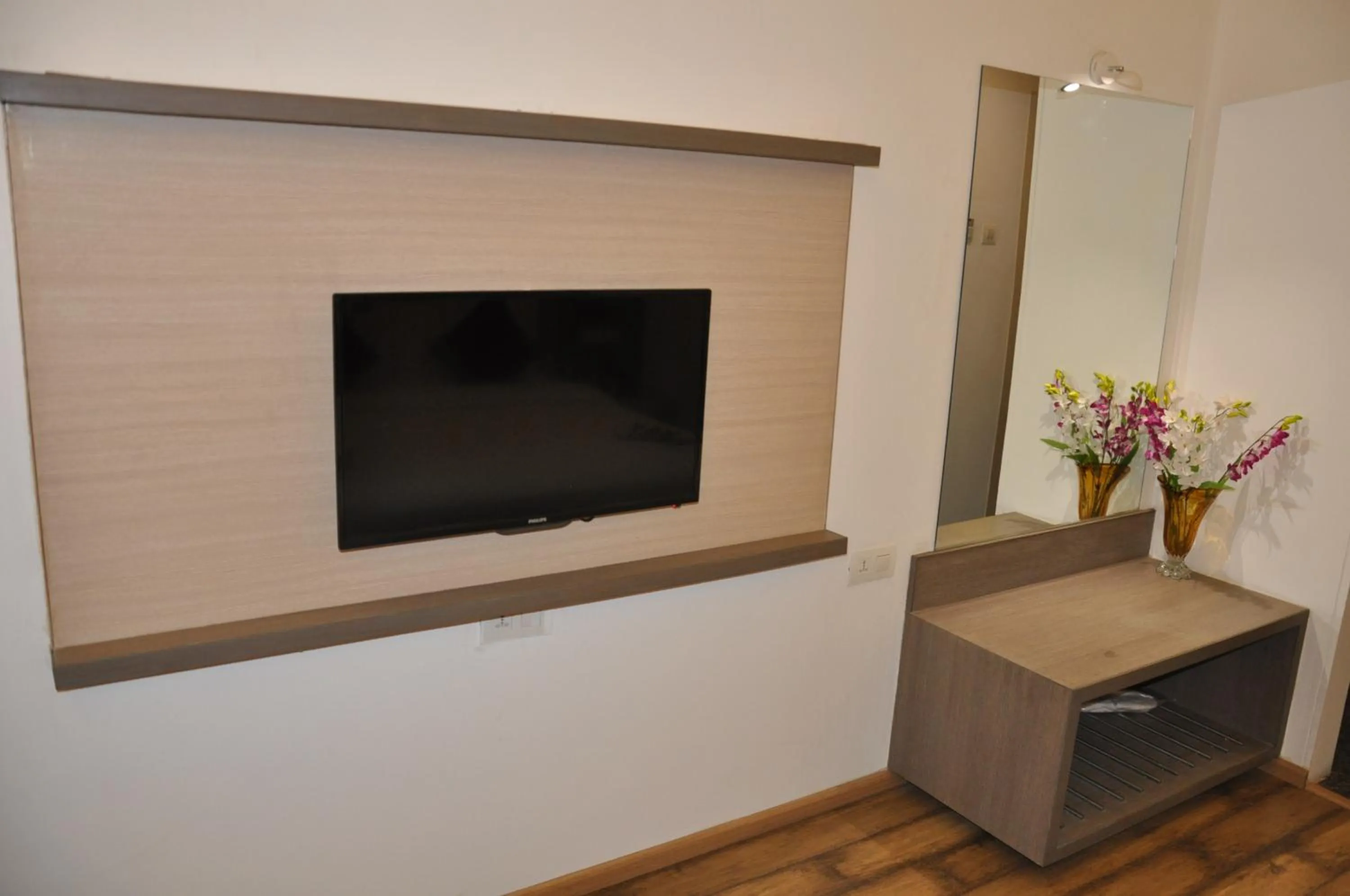 TV and multimedia in Pride Biznotel Manjusar Vadodara Near Sokhda Lake