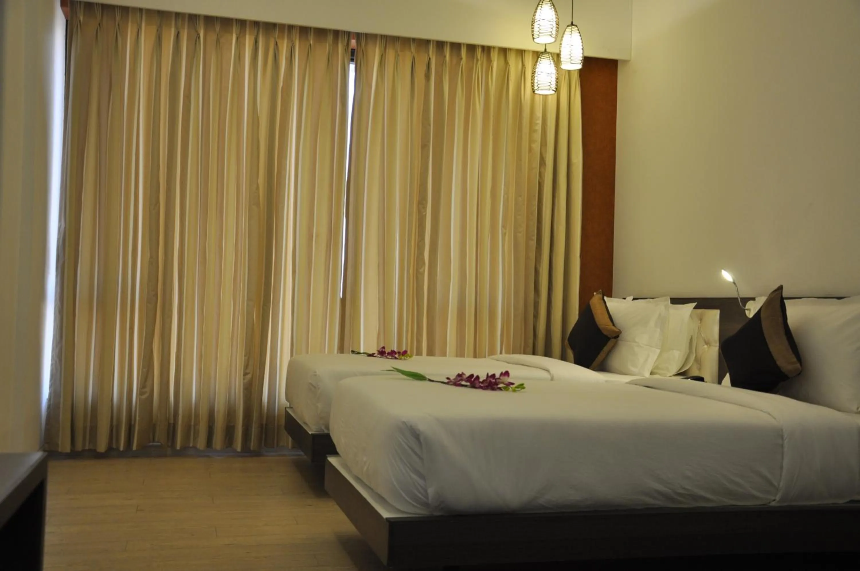 Photo of the whole room, Bed in Pride Biznotel Manjusar Vadodara Near Sokhda Lake