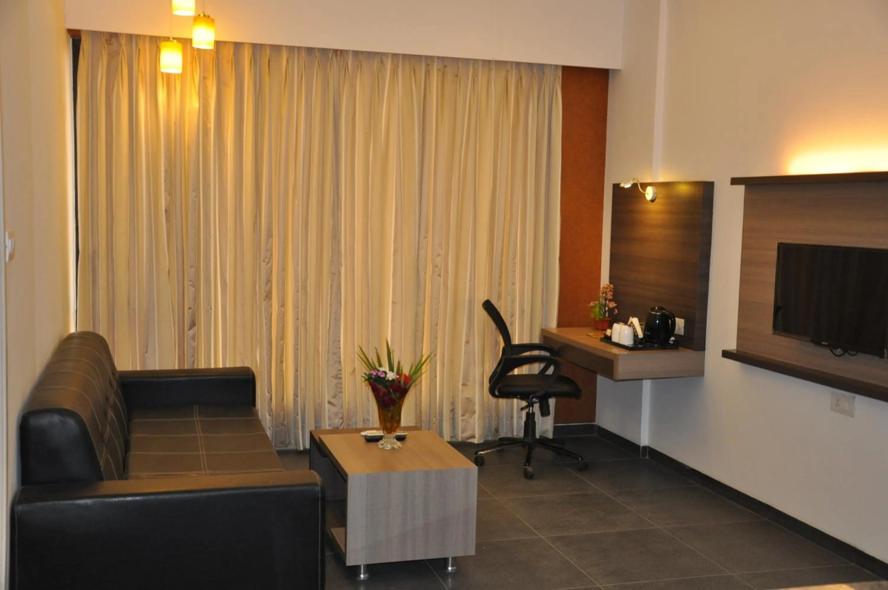Living room in Pride Biznotel Manjusar Vadodara Near Sokhda Lake