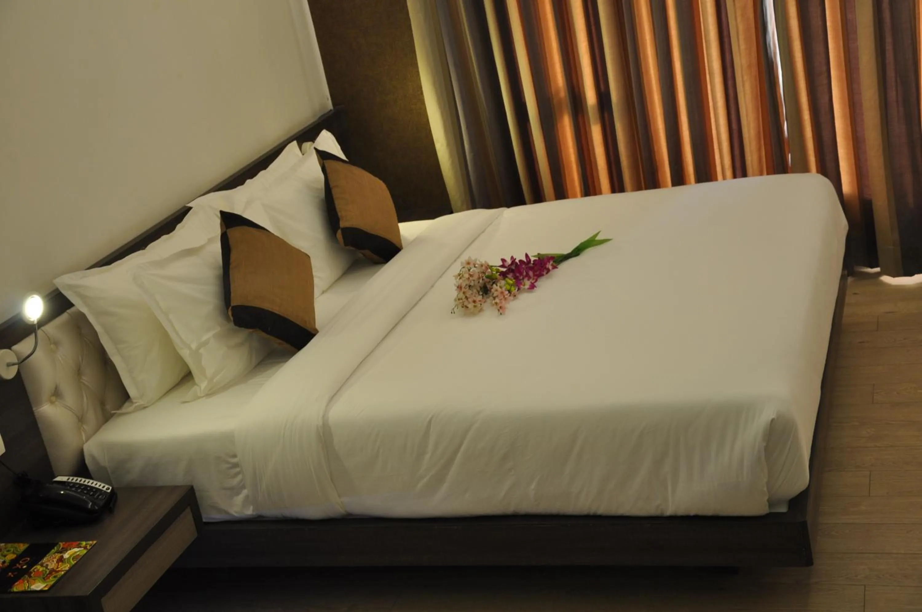 Photo of the whole room, Bed in Pride Biznotel Manjusar Vadodara Near Sokhda Lake