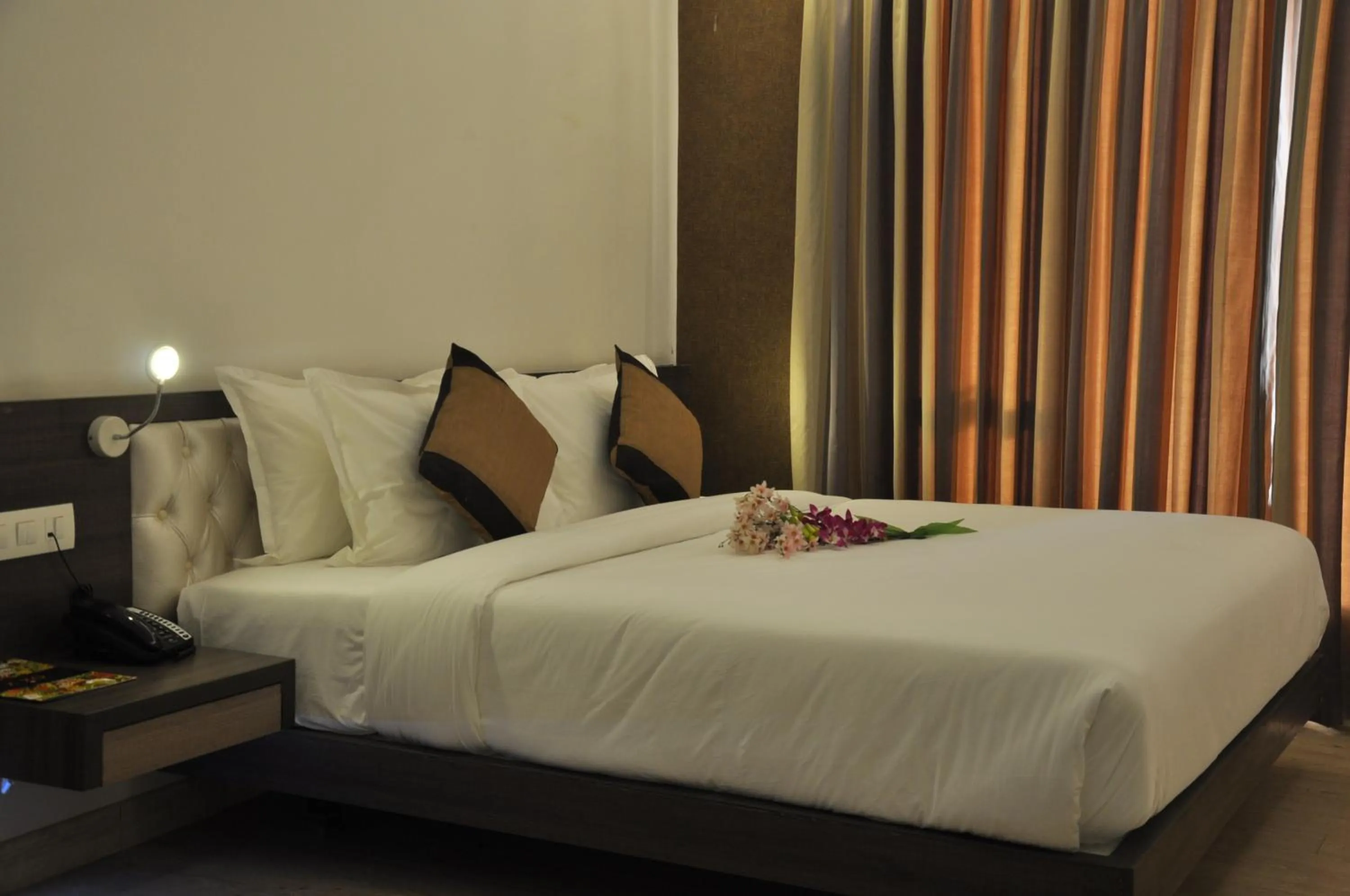 Photo of the whole room, Bed in Pride Biznotel Manjusar Vadodara Near Sokhda Lake