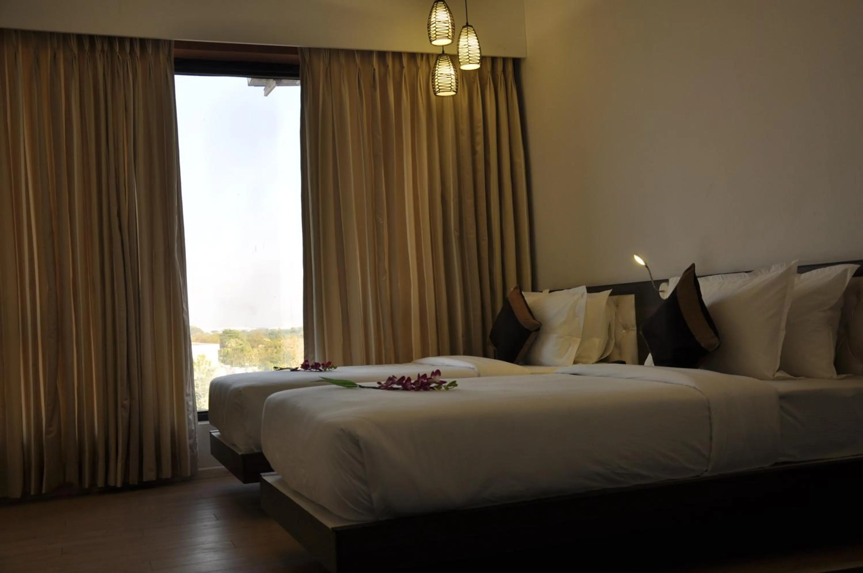 Photo of the whole room, Bed in Pride Biznotel Manjusar Vadodara Near Sokhda Lake