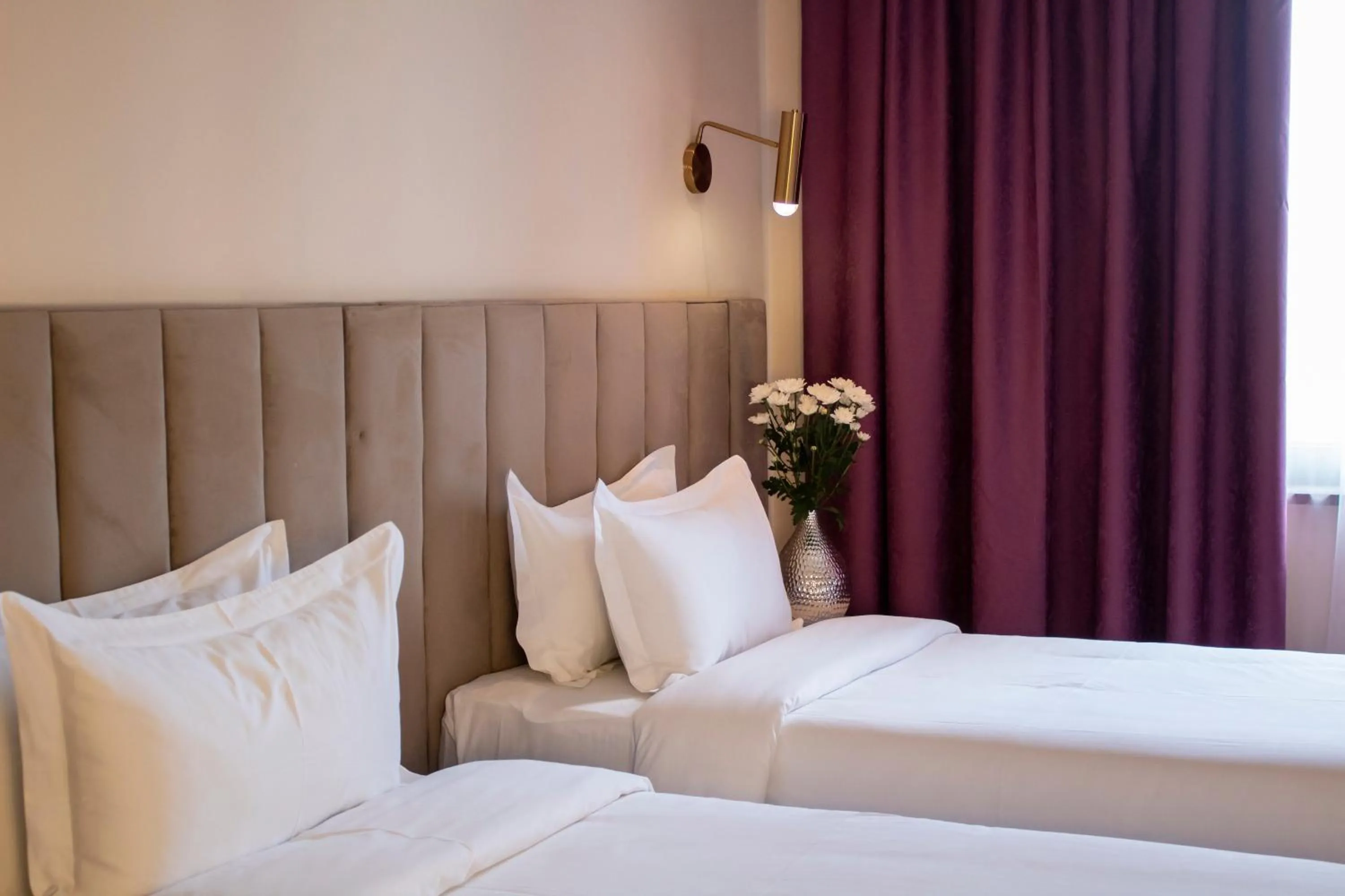 Bed in Orient Hotel Bishkek