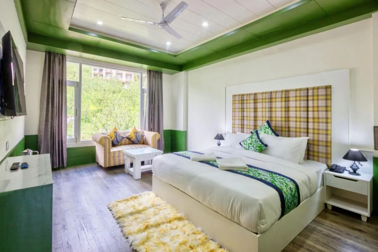 TV and multimedia, Bed in vella Marina Group of hotels Sol Resort Manali #Atithi Devo Bhava hotel in manali #Free Parking #Mall Road 500m#Mountain view hotel