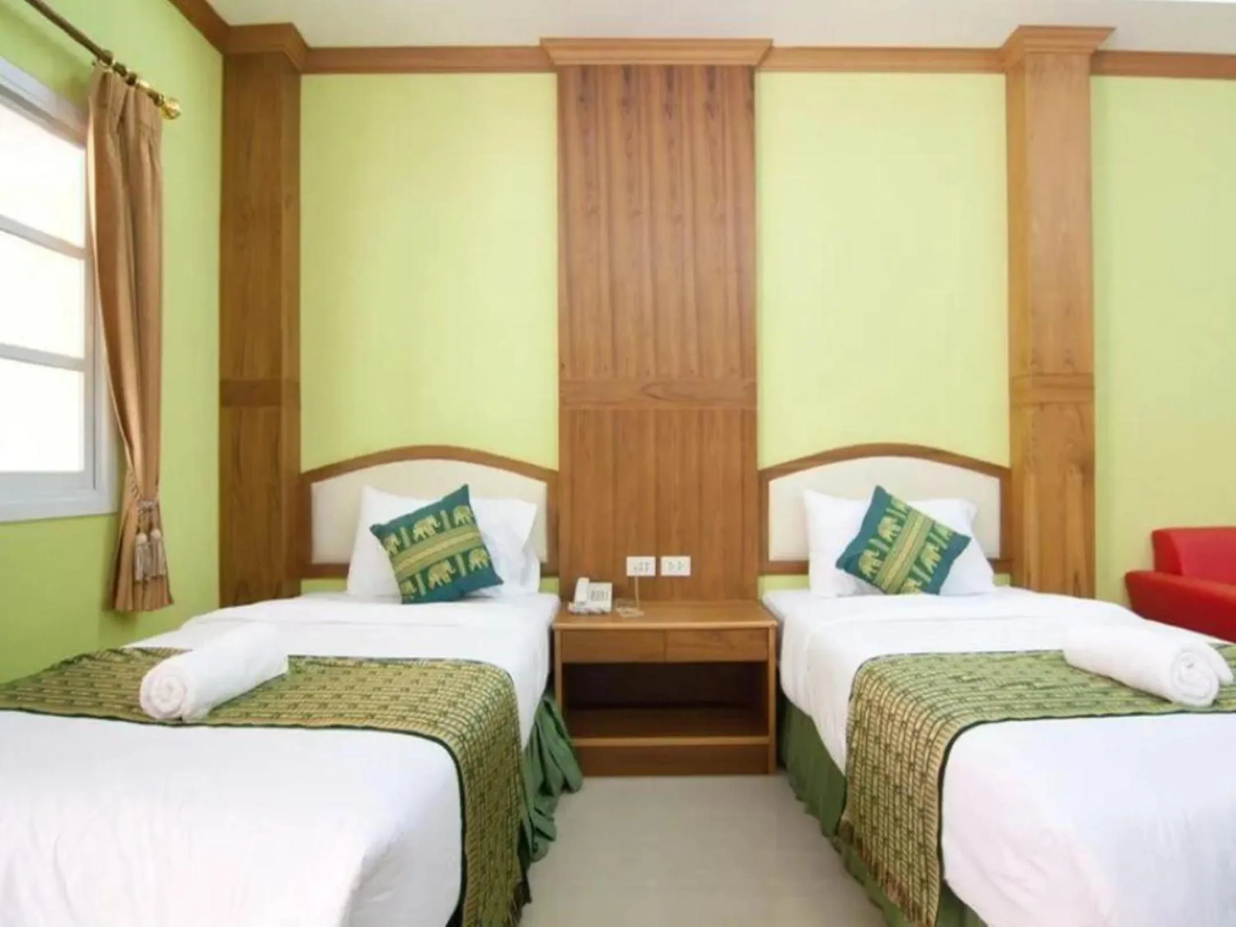 Bed in Ampan Resort & Apartment