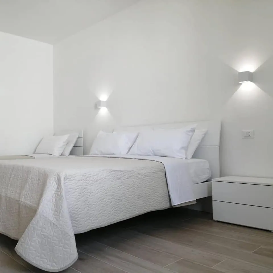 Bed in AMARE Bed & Breakfast