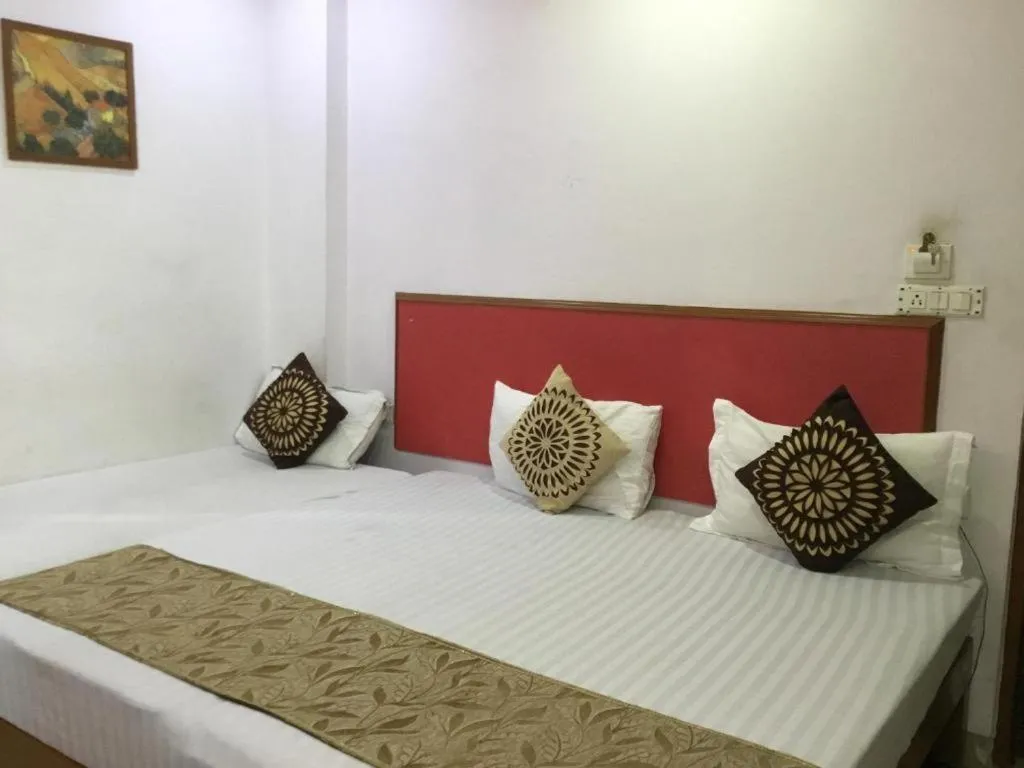 Bed in AIRPORT SKY INN HOMESTAY