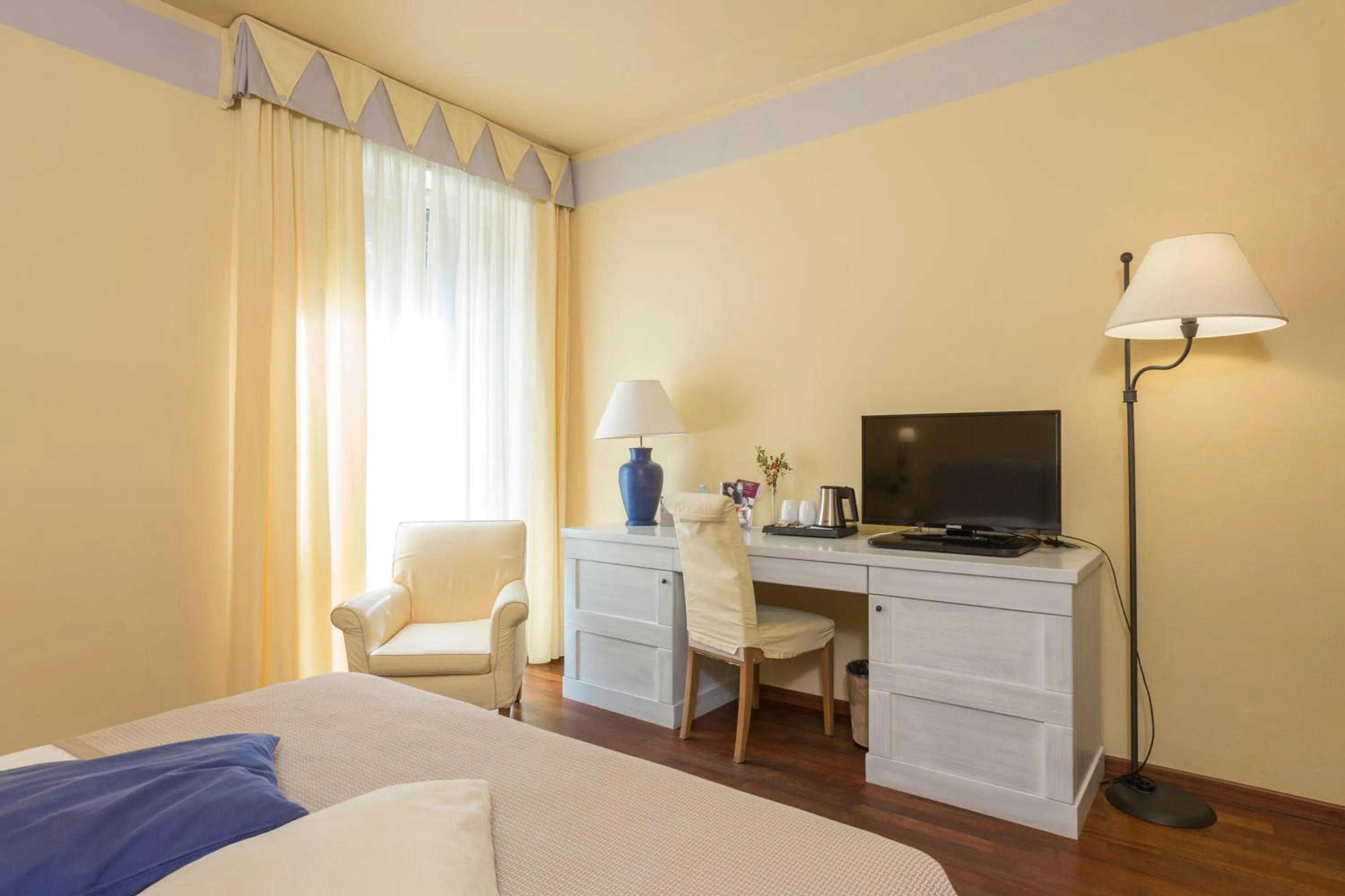 Photo of the whole room, Bed in TH Tirrenia - Green Park Resort