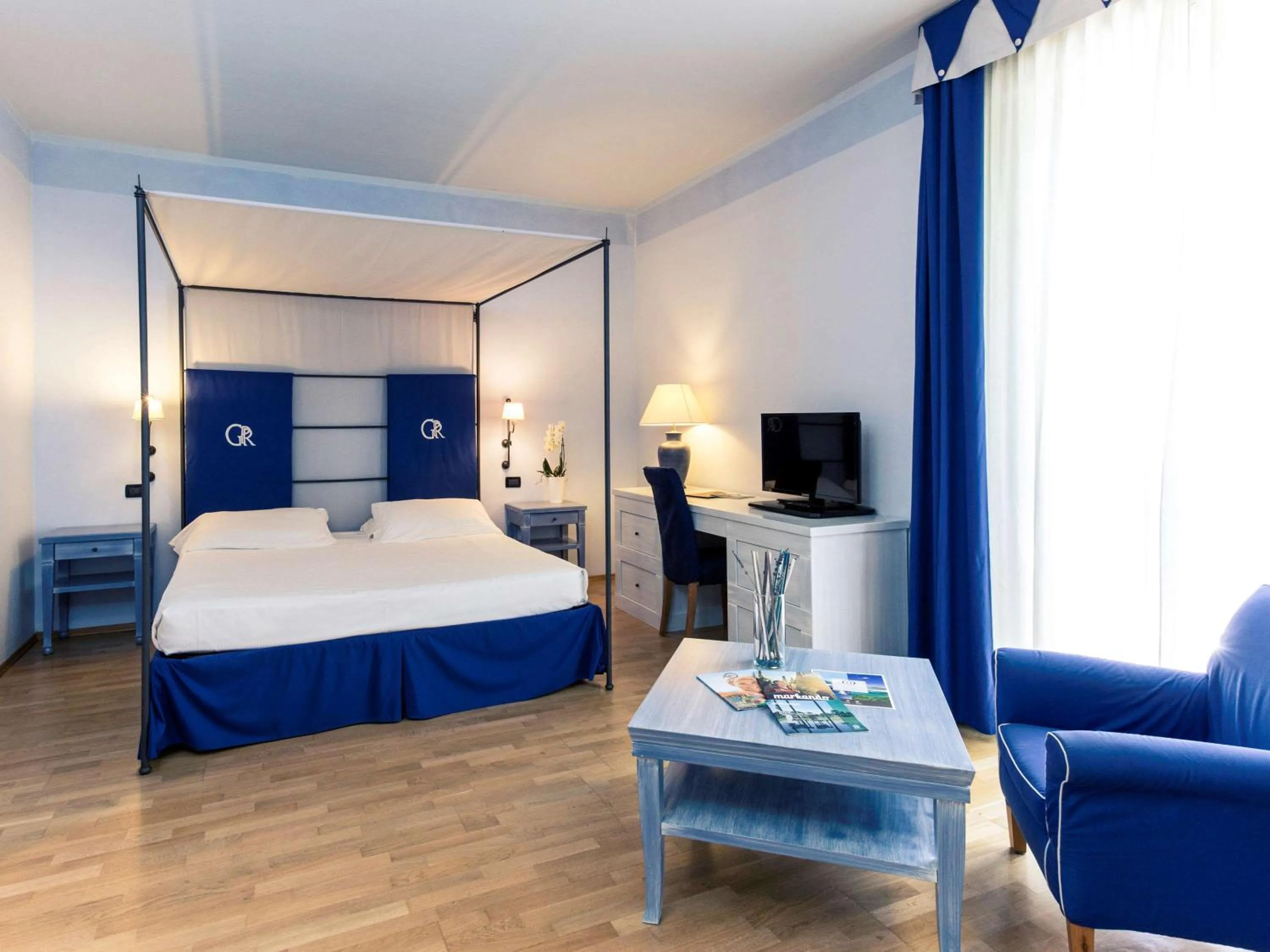 Photo of the whole room, Bed in TH Tirrenia - Green Park Resort