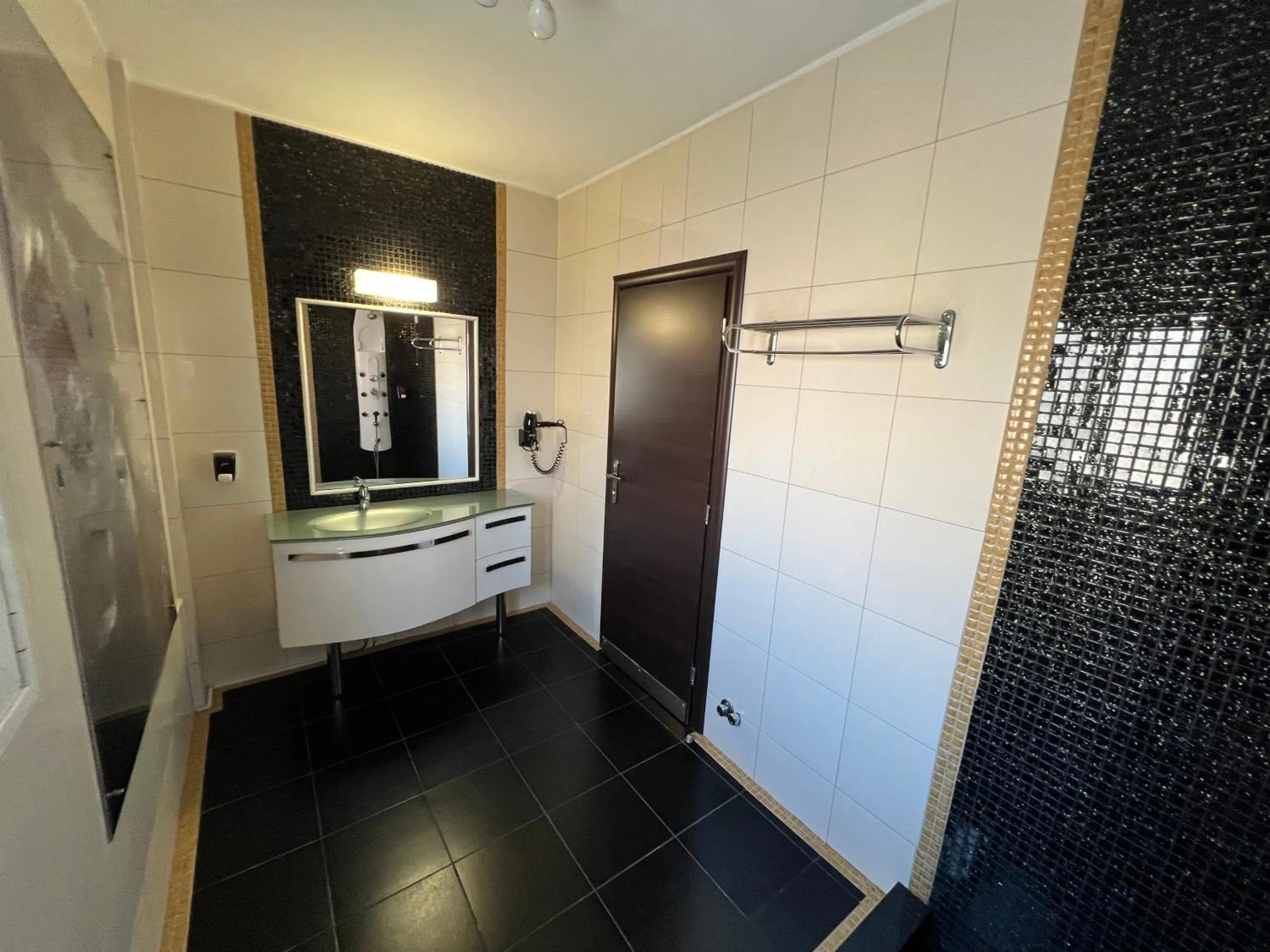 Bathroom in Xcite Hotel Salem