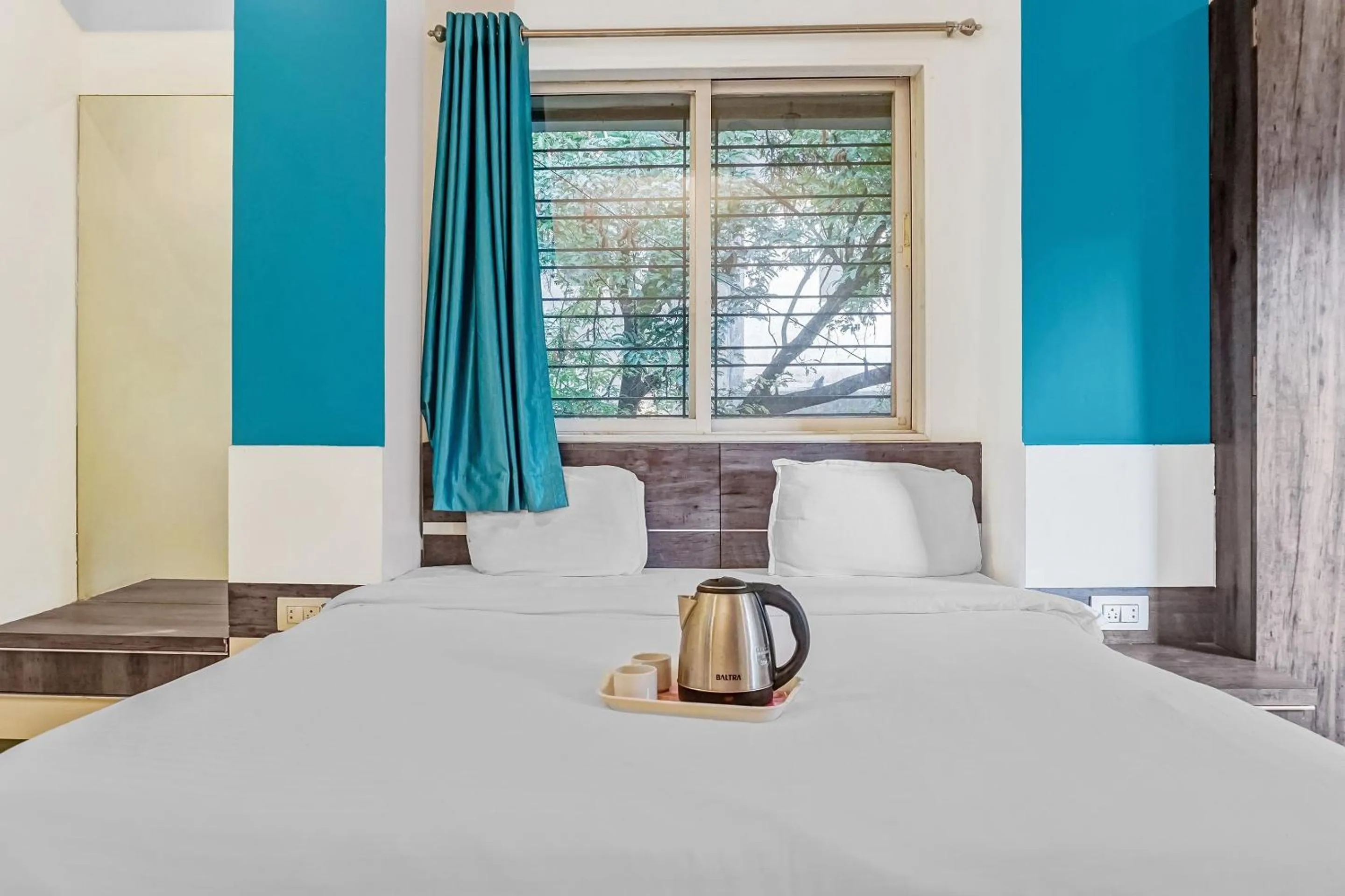 Bedroom, Bed in Super Townhouse The Upper Room Near Pune Airport