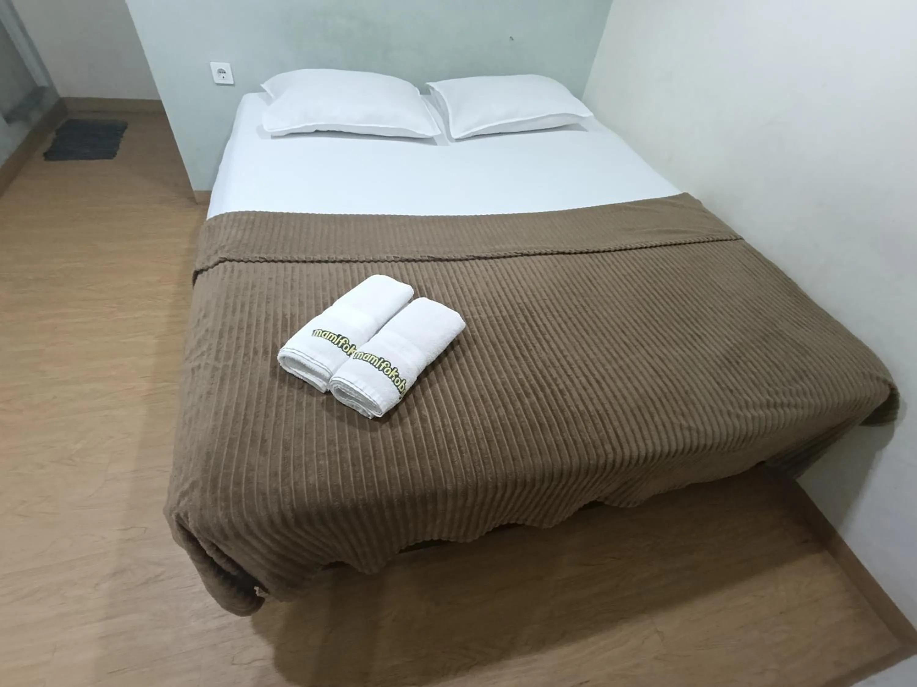 Bed in Mamifokobo Guest House