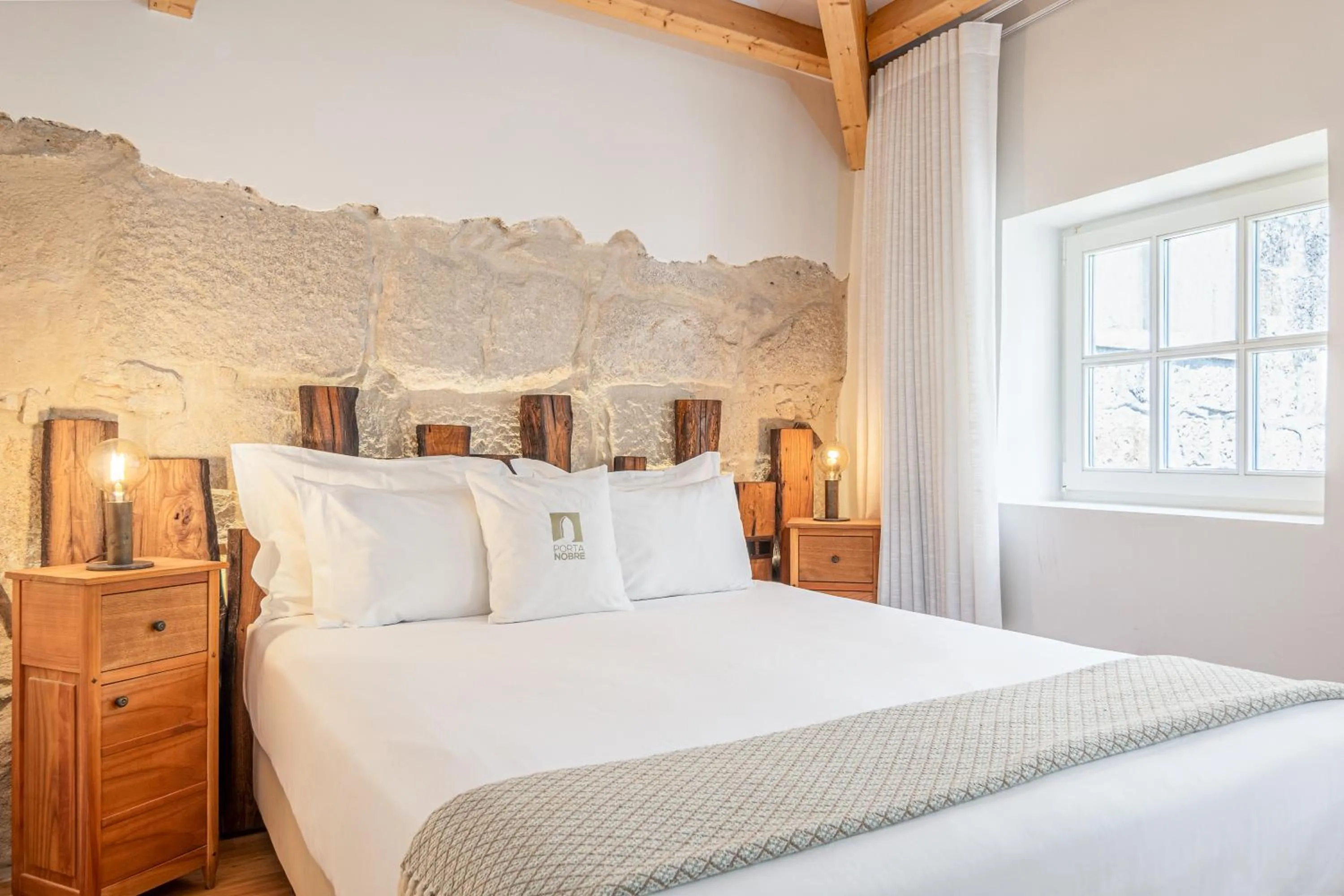 Bed in Porta Nobre Boutique Hotel by Aspasios