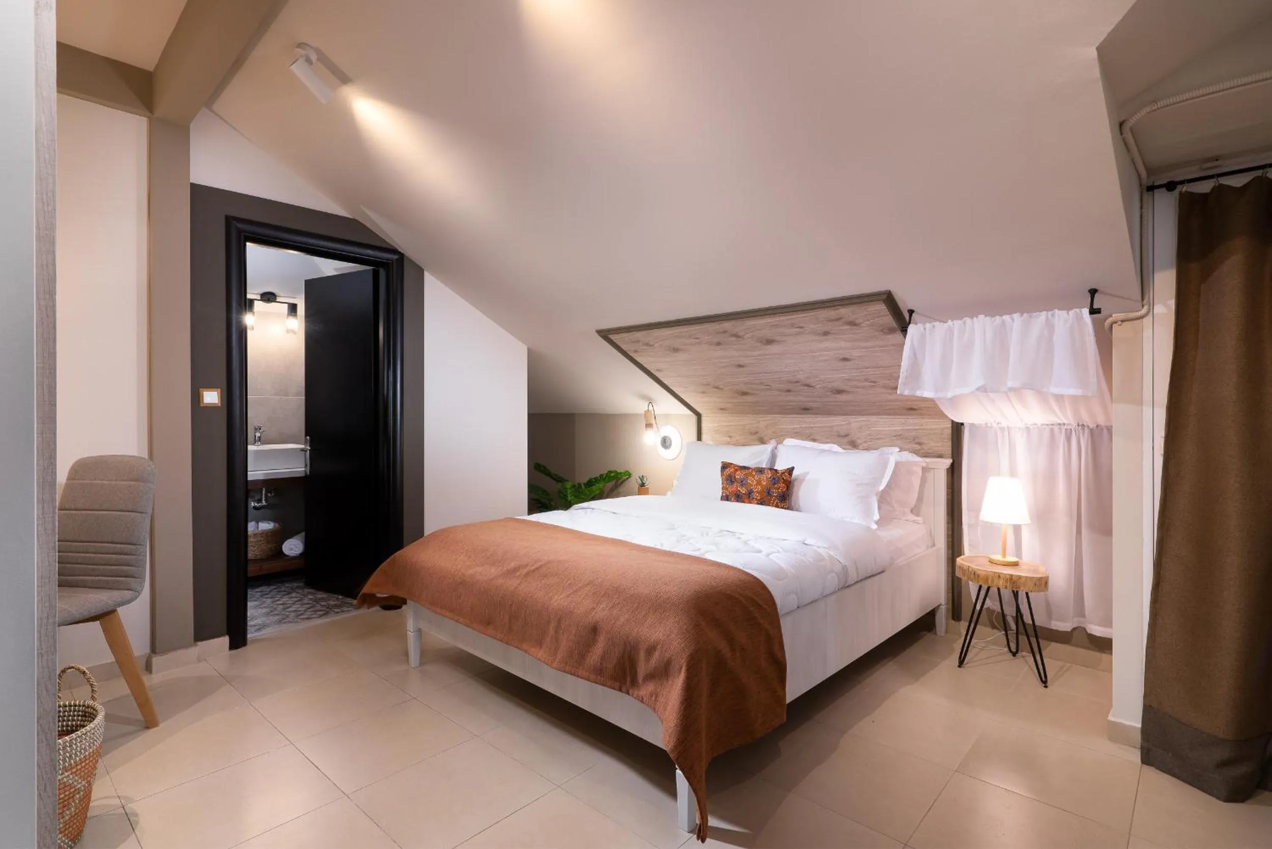 Bed in ELLE Rooms & Suites