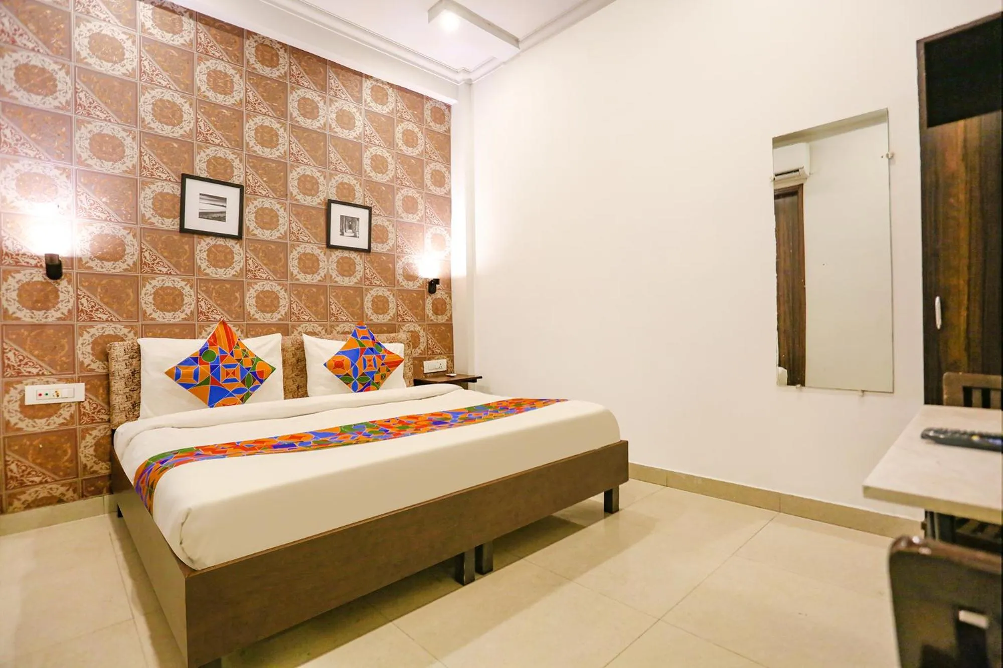Photo of the whole room, Bed in FabExpress Novel Suites - Nr Yashobhoomi Convention Centre