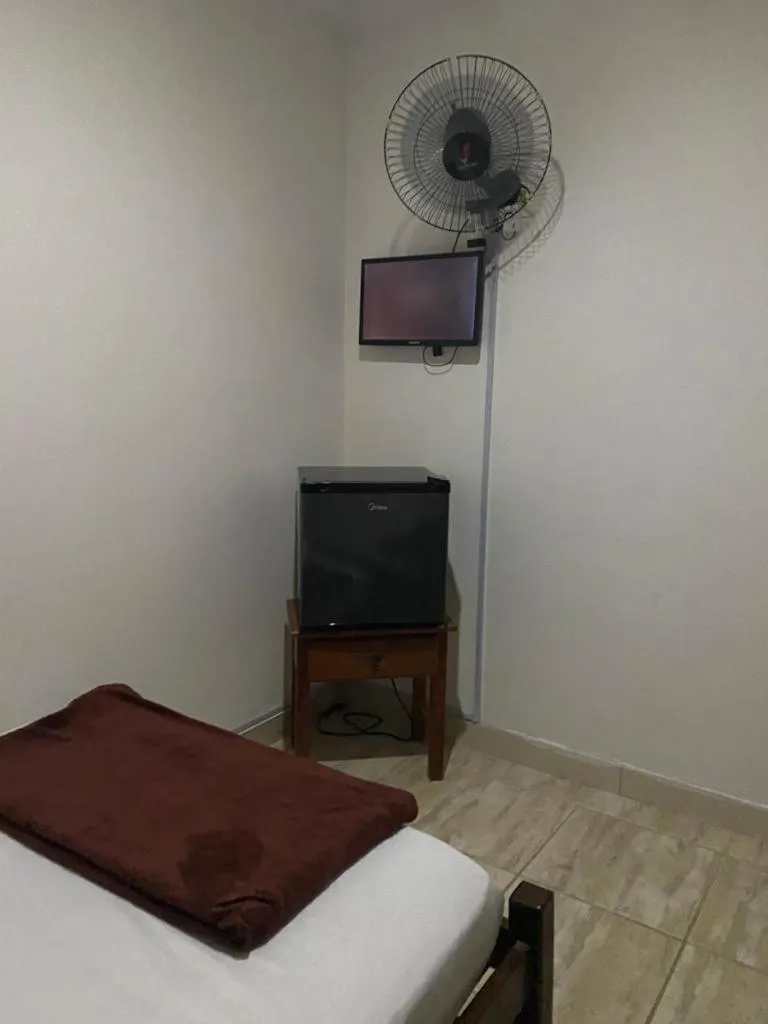 Bed in Pousada Casa de mãe aconchegante com piscina próximo à praia