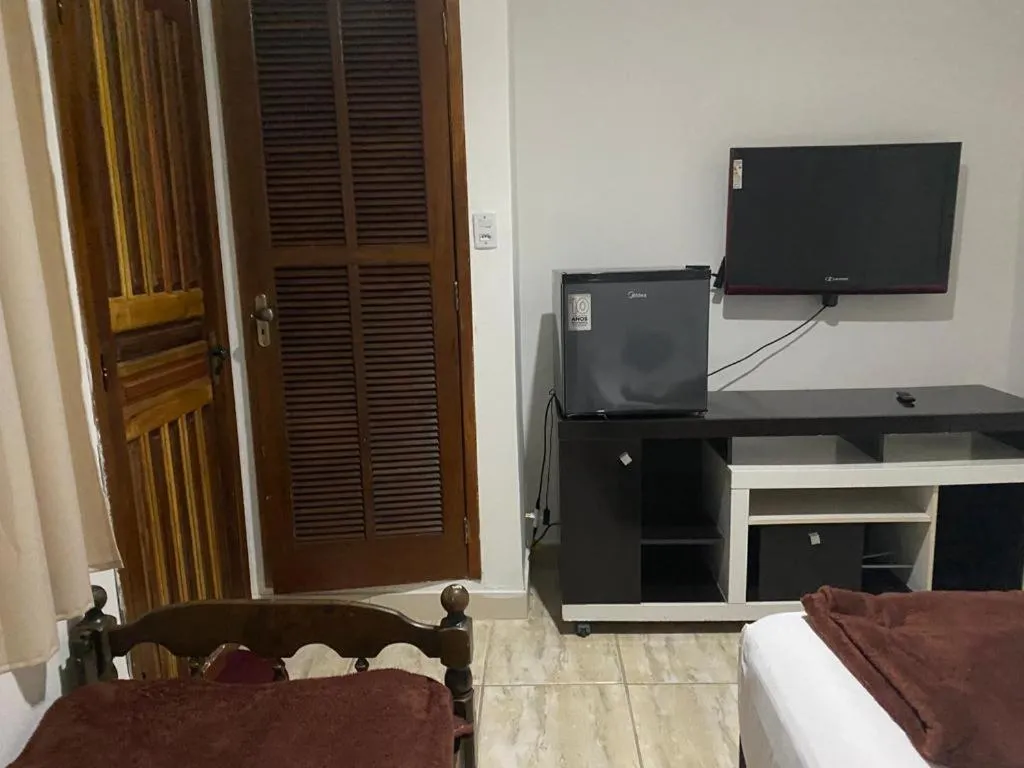 Bed in Pousada Casa de mãe aconchegante com piscina próximo à praia