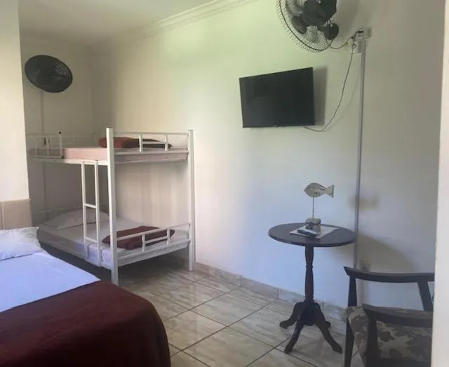 Bed in Pousada Casa de mãe aconchegante com piscina próximo à praia