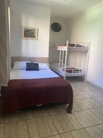 Bed in Pousada Casa de mãe aconchegante com piscina próximo à praia