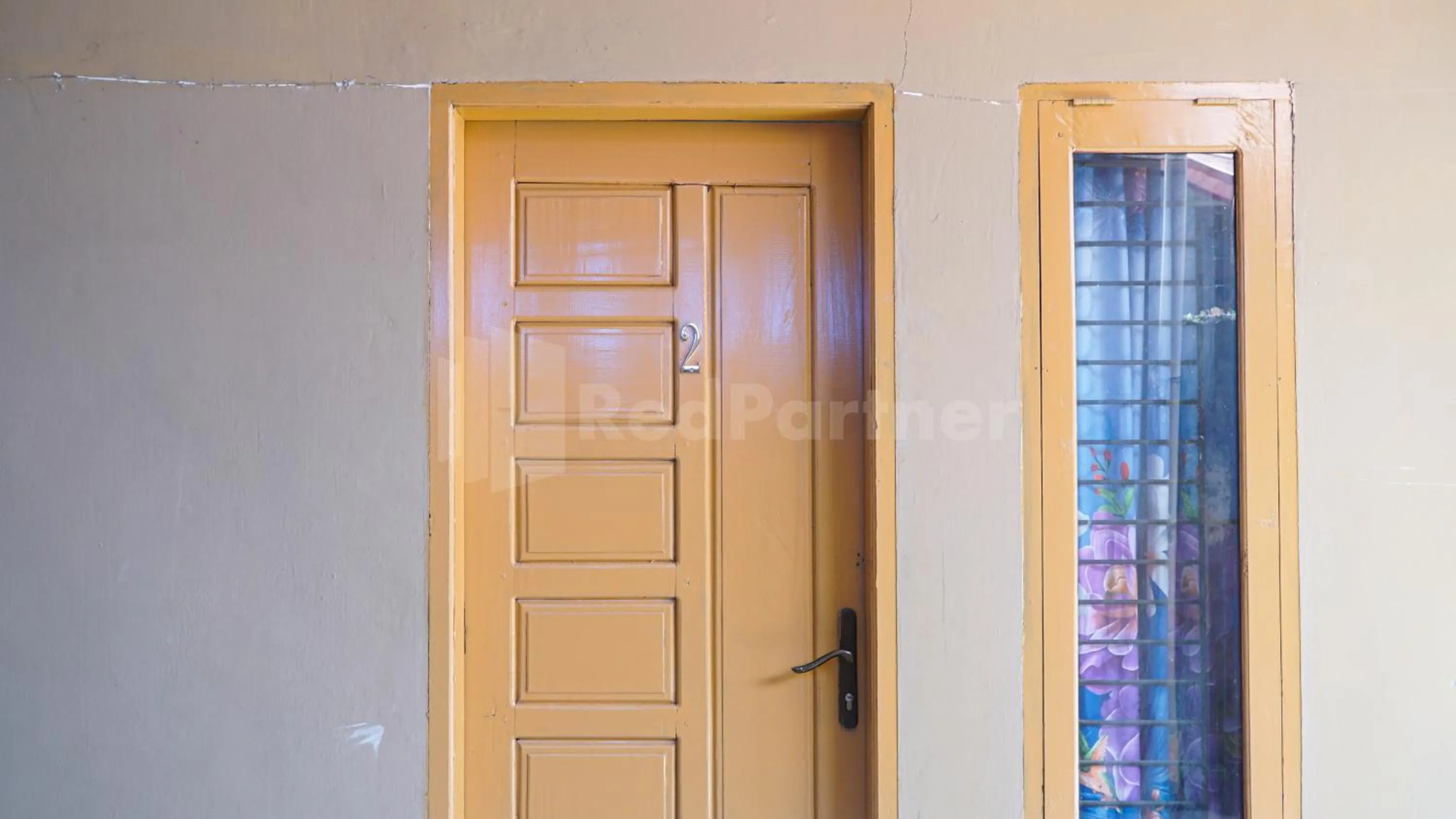 Facade/entrance in The Karo's Residence Mitra RedDoorz