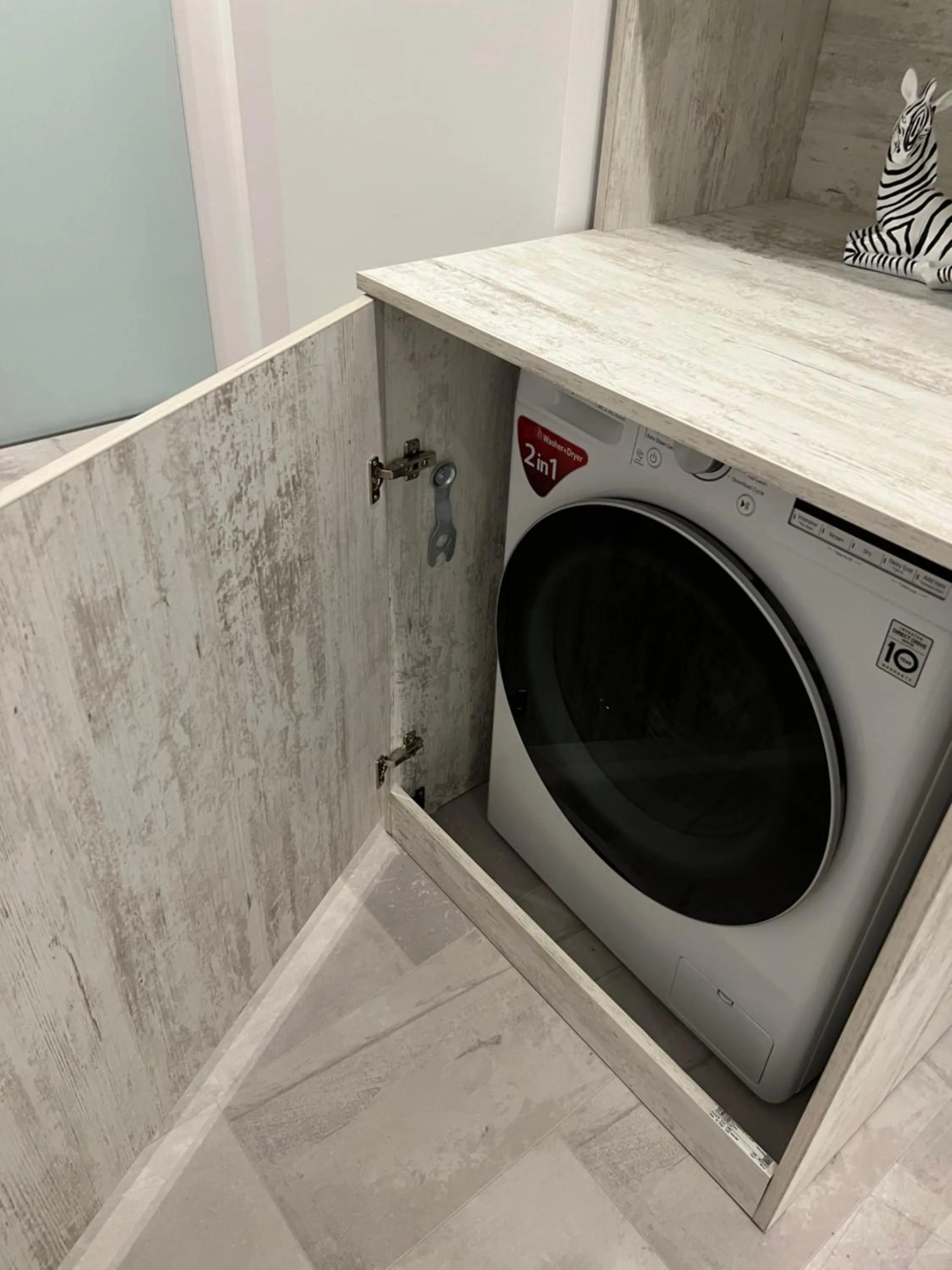 washing machine in Amazing 2-Room Penthouse Cityview W13