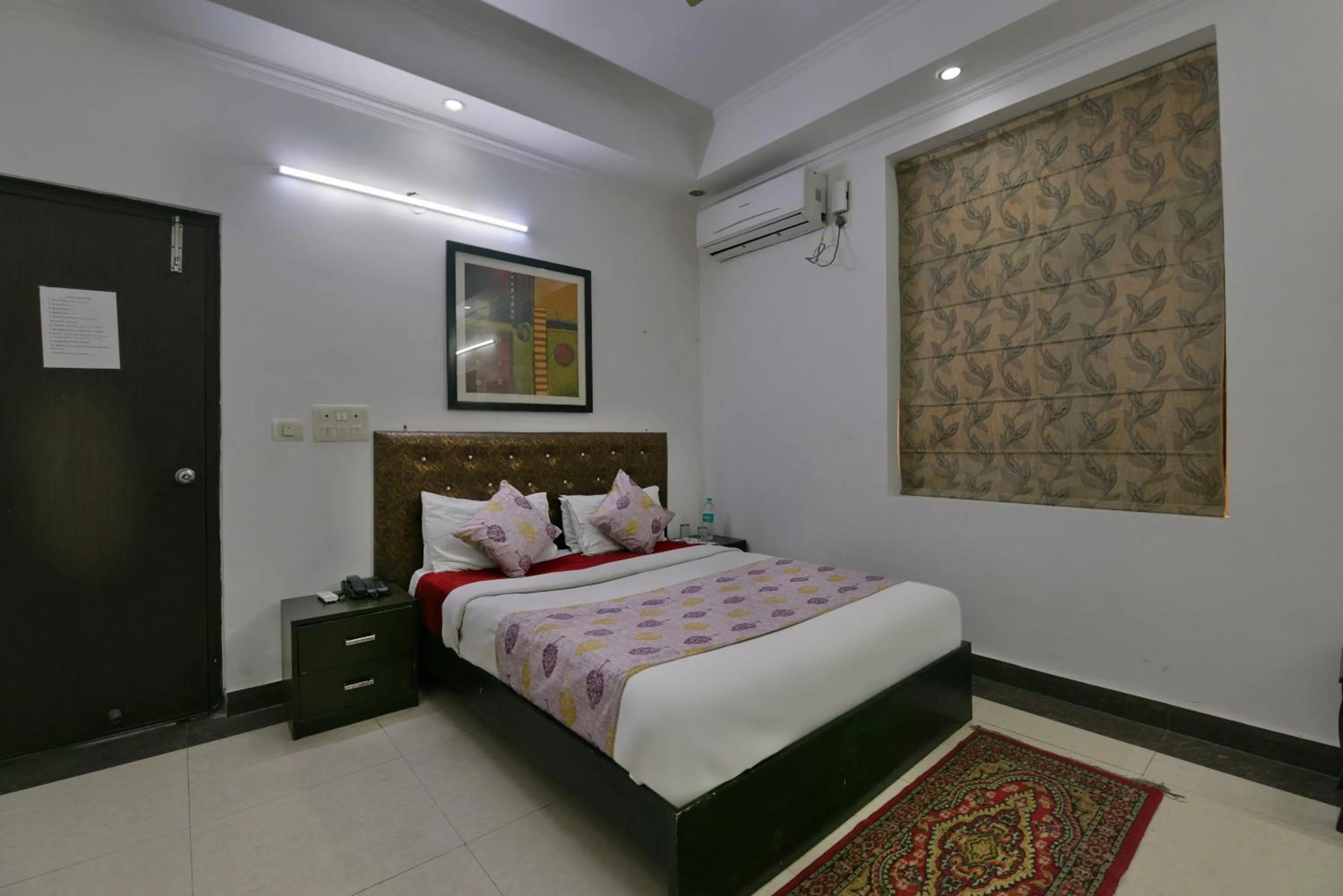 Bed in Hotel Diamond Stays