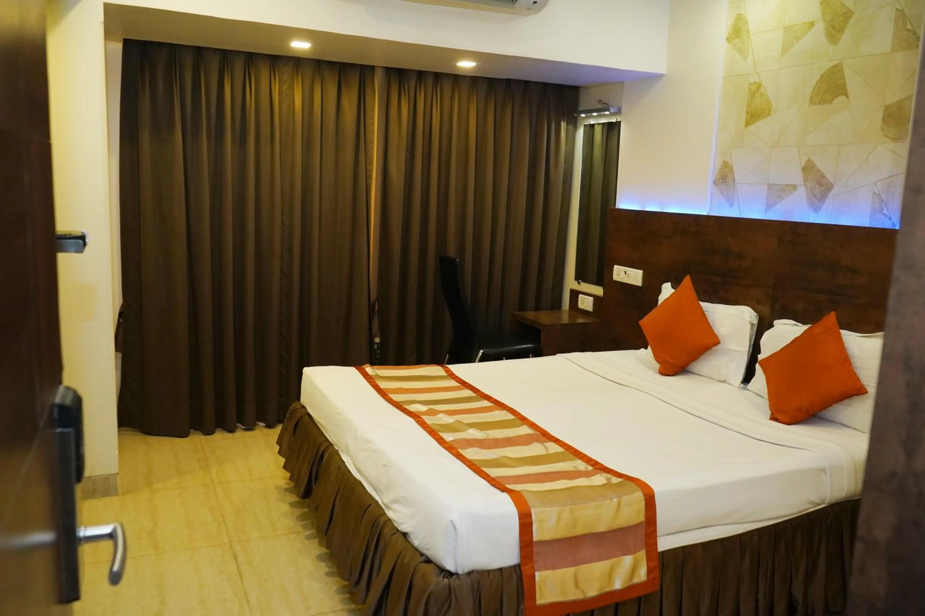 Bedroom, Bed in Hotel Spices Navi Mumbai