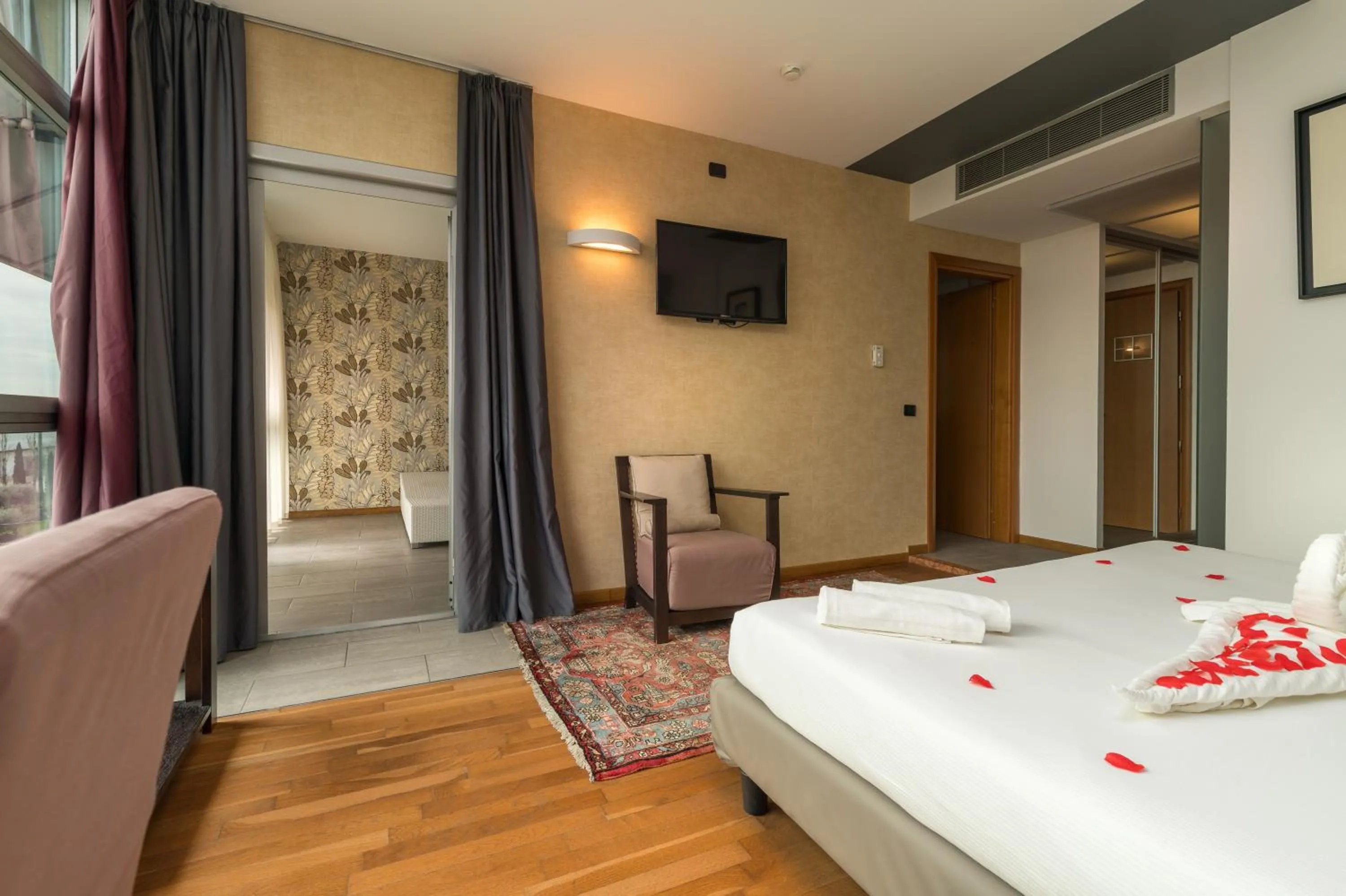 Communal lounge/ TV room in Hotel Antares Sport Beauty & Wellness